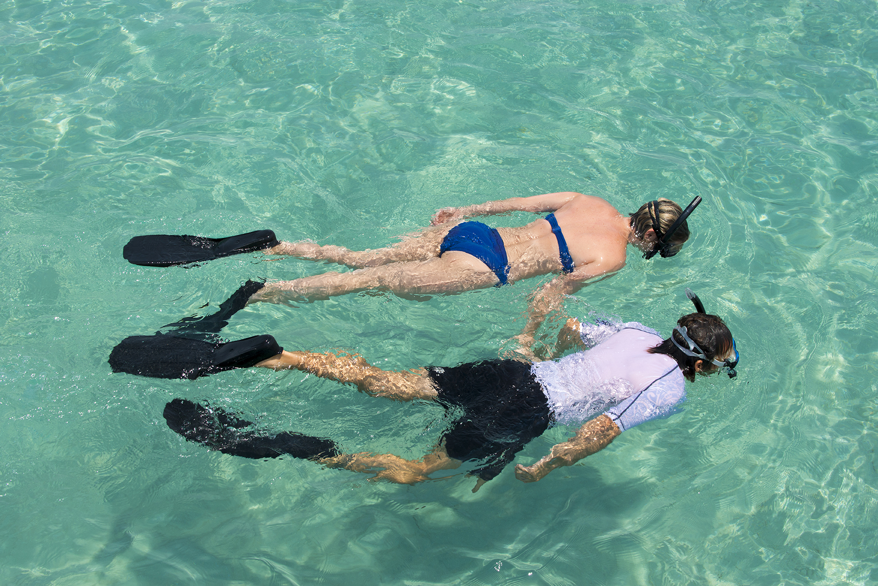 Snorkel in the azure waters of Buenguerra Island