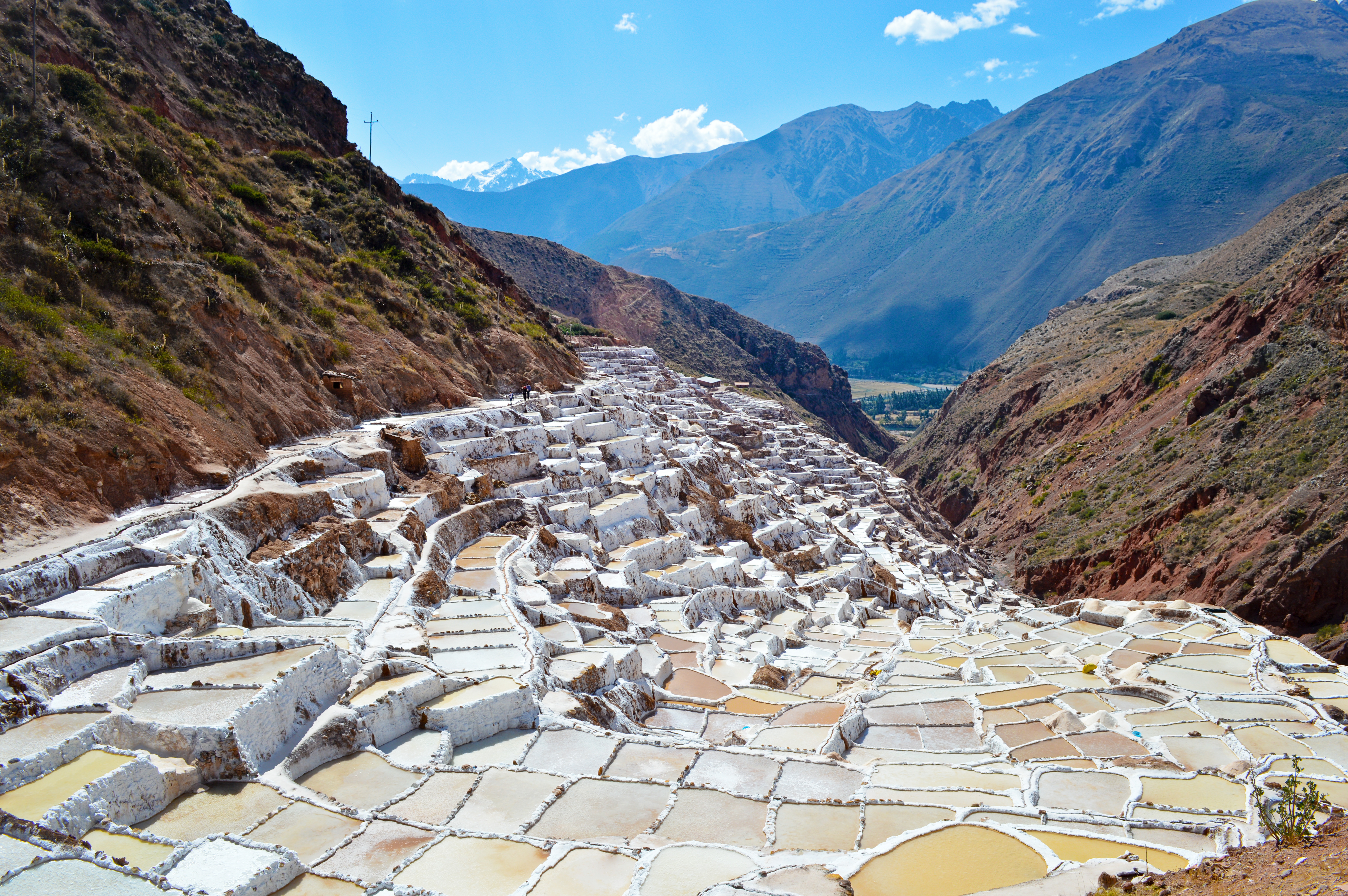 Look over the surreal view of the Maras salt mines