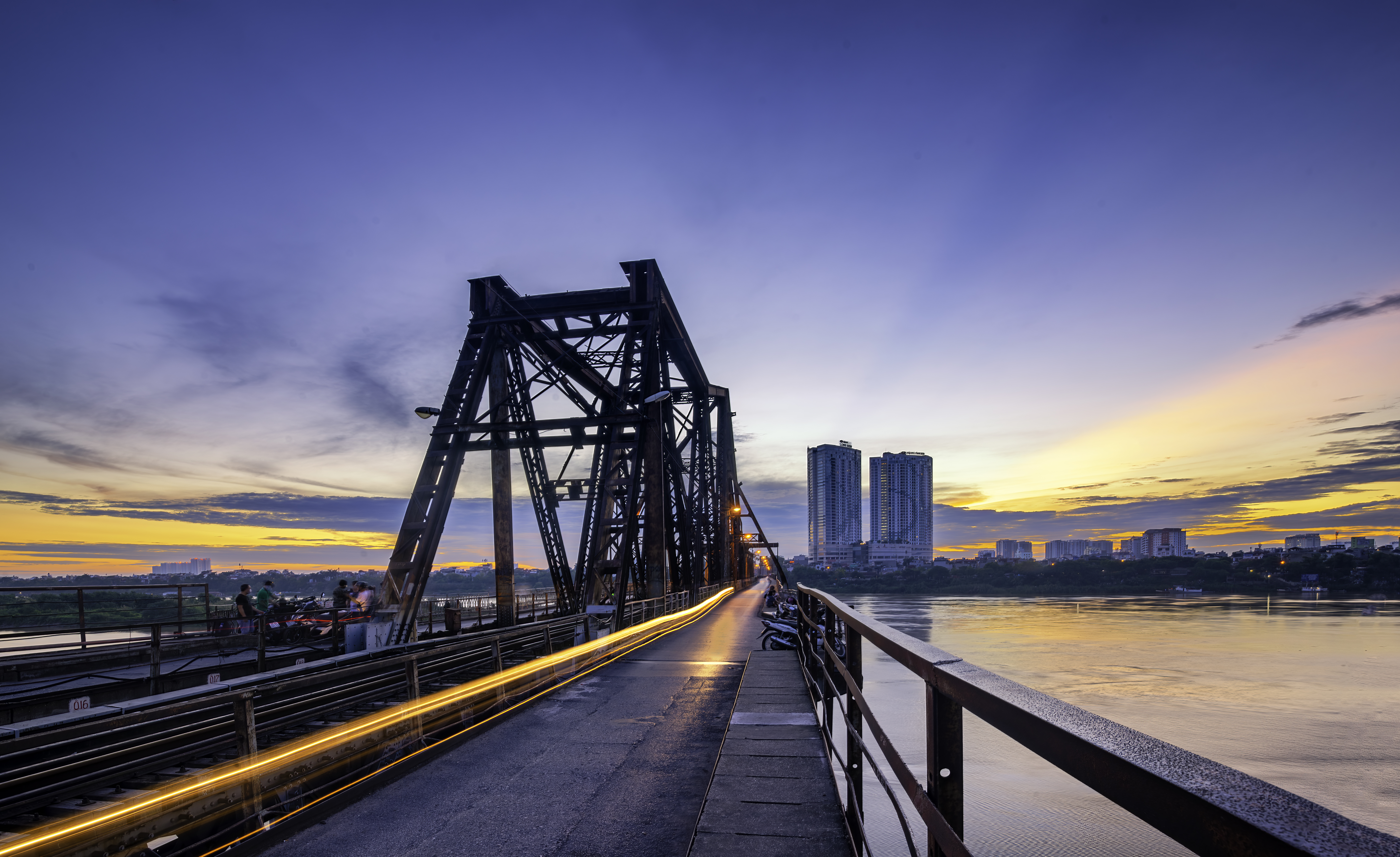 Walk across the Long Bien Bridge in Hanoi