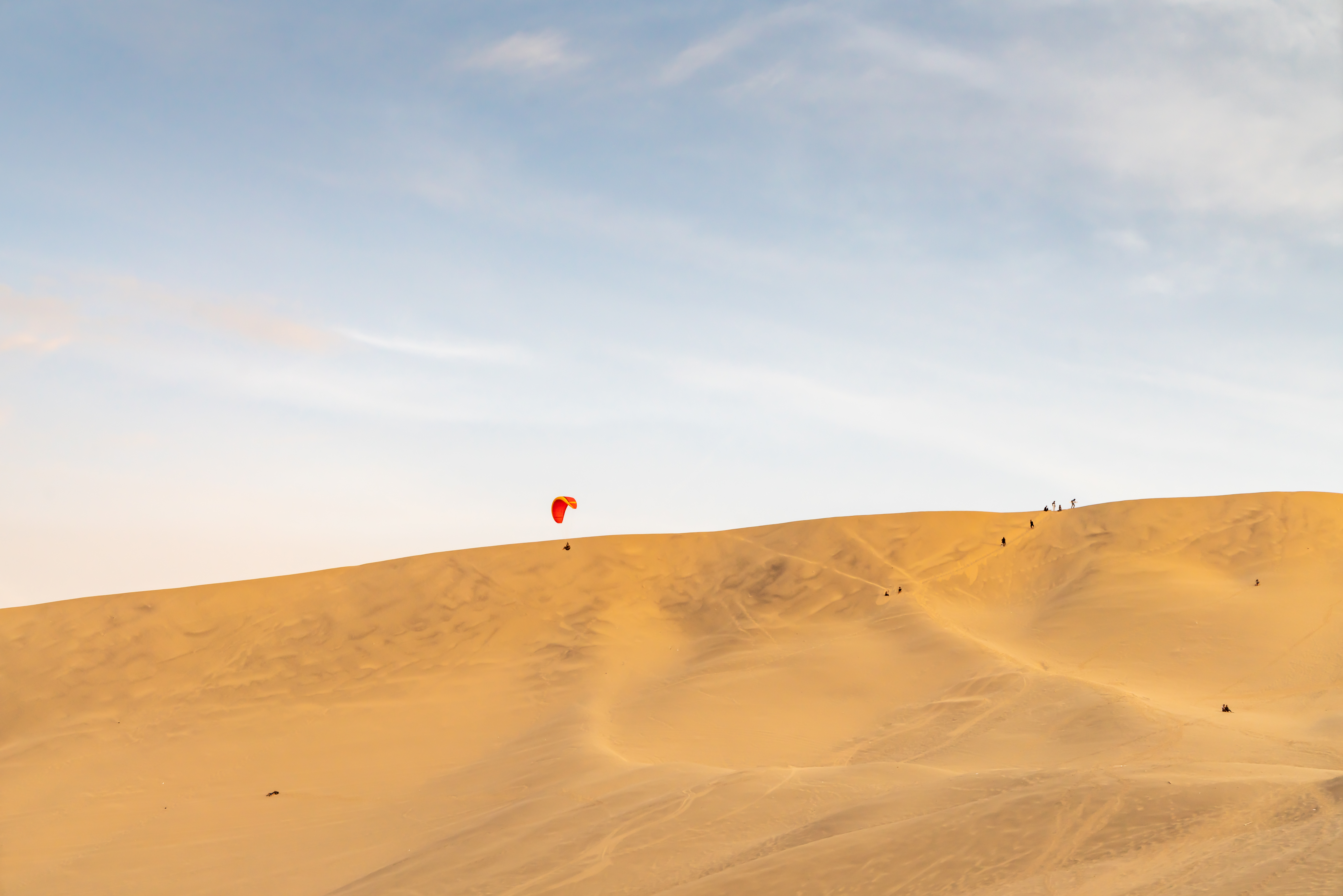 Paraglide above the sand ravines of Paracas