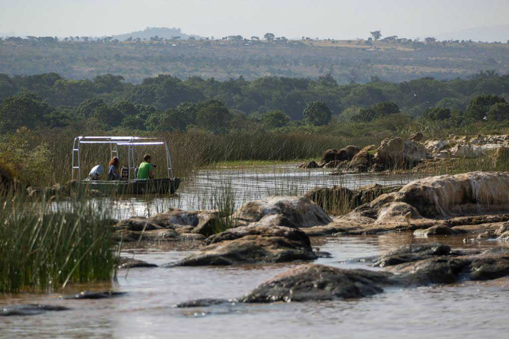 Boat past crocodiles on scenic Lake Chamo