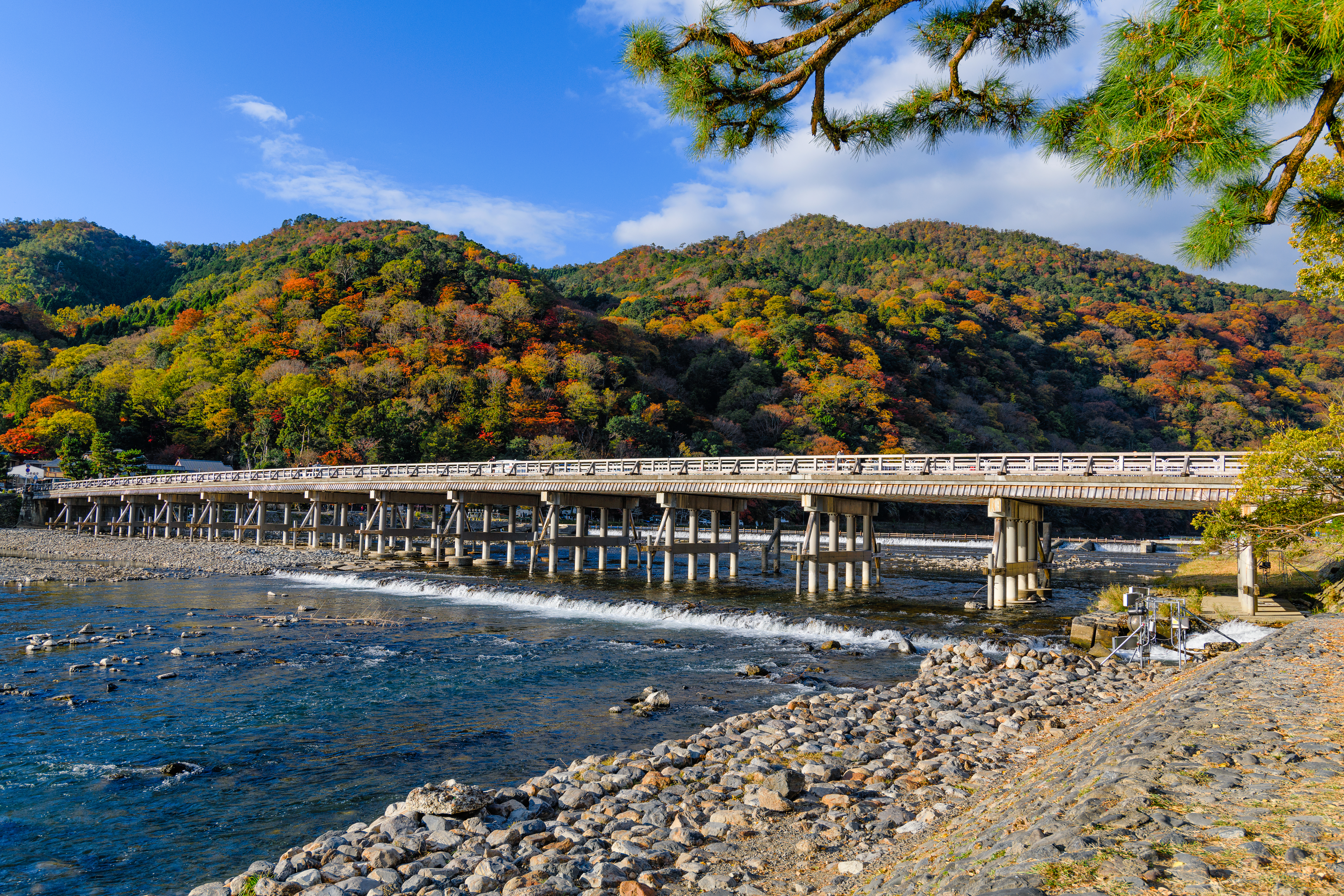 Walk across the ancient Togetsukyo Bridge, Kyoto
