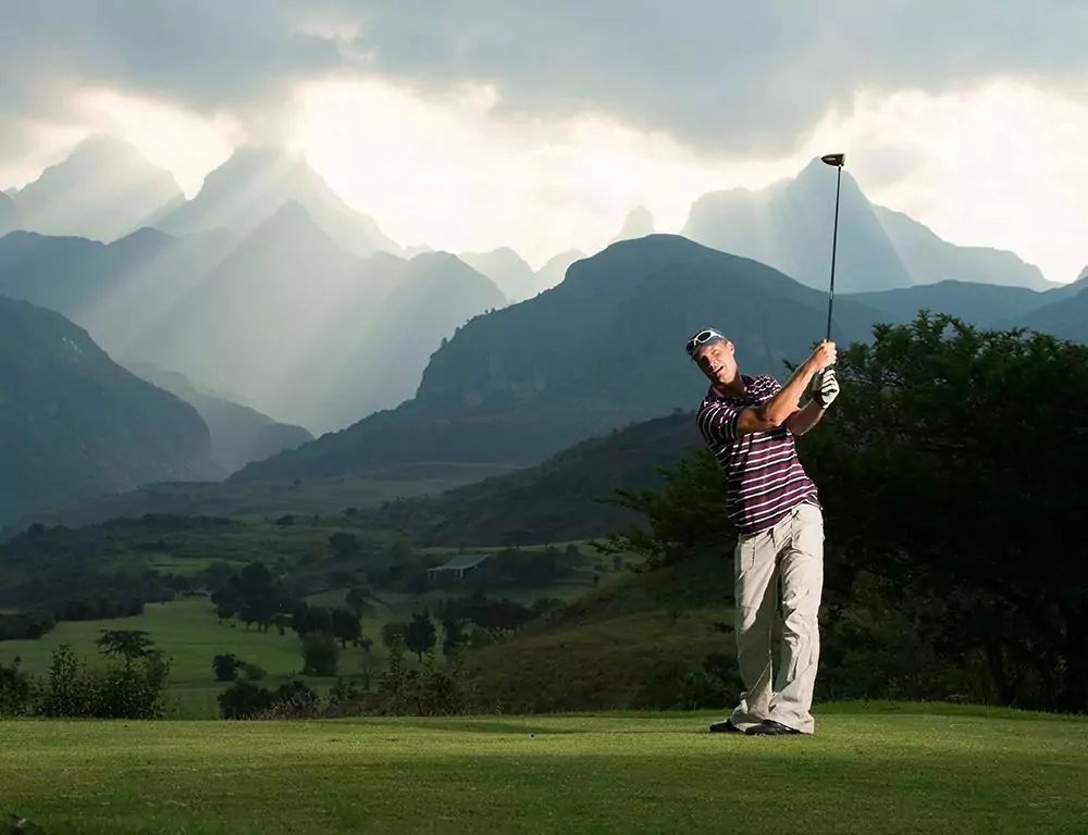 Golf with the Drakensberg mountains as a backdrop