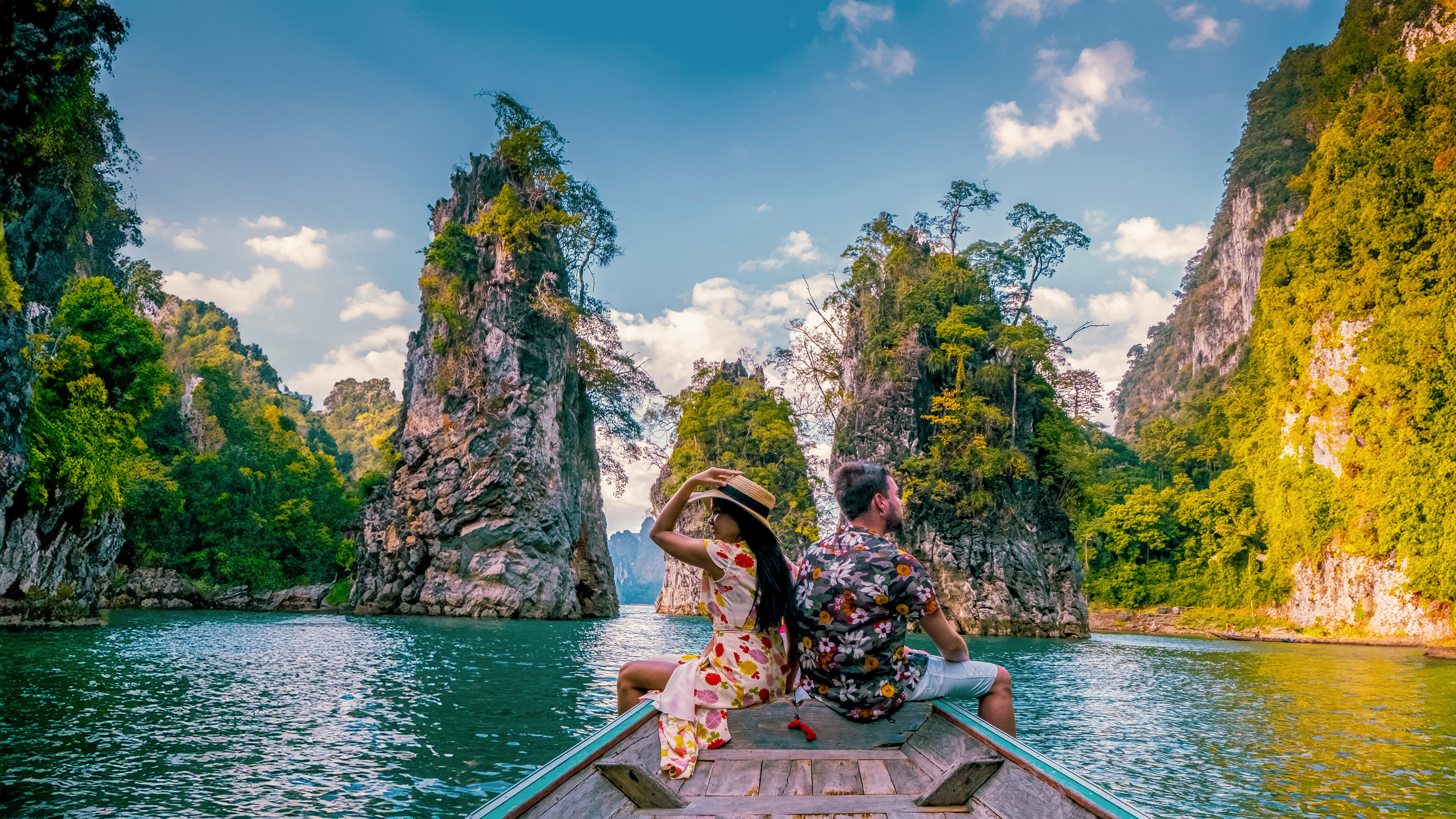 Board long-tail boats across the Cheow Lan Lake