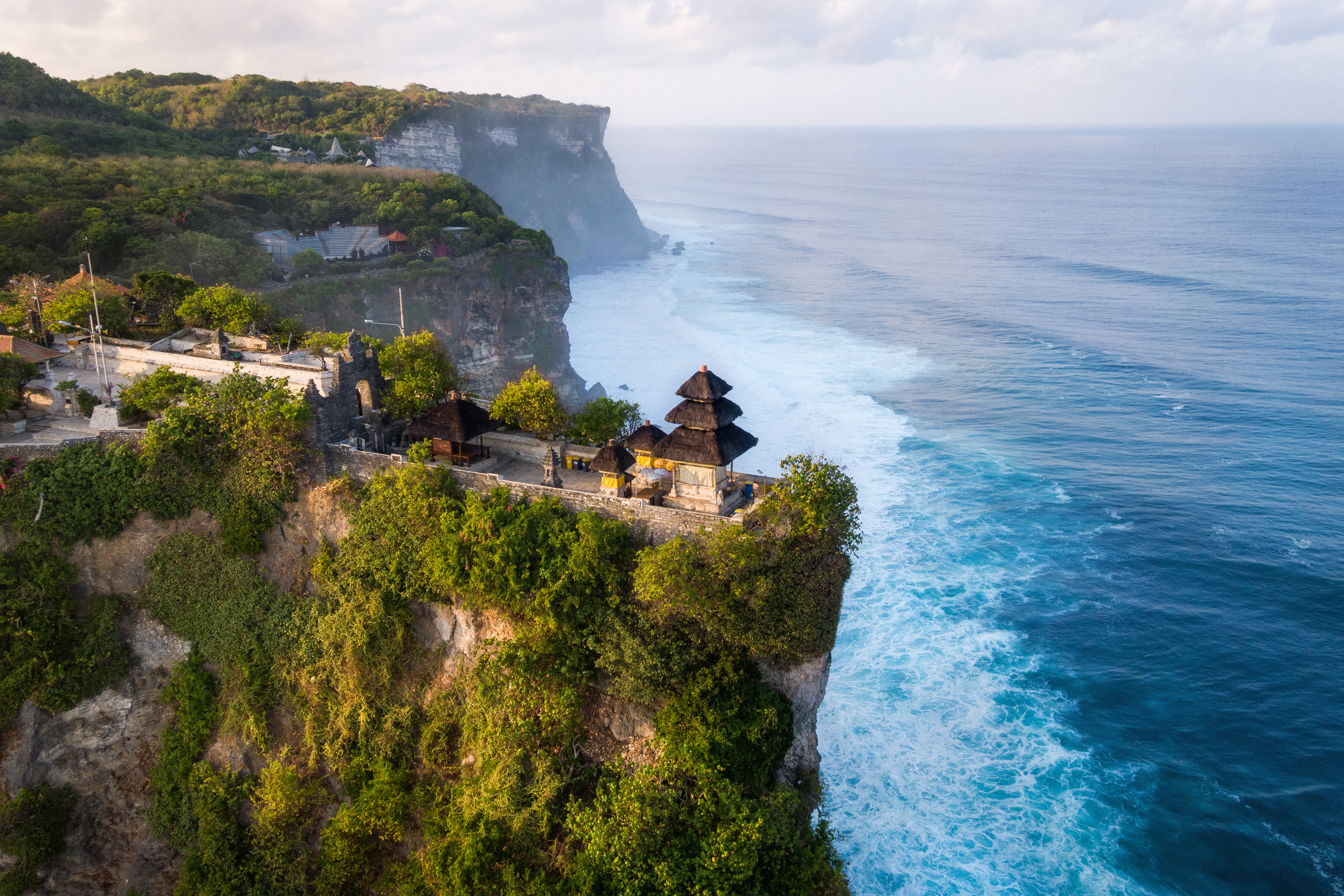 Visit the Uluwatu temple at the cliff top