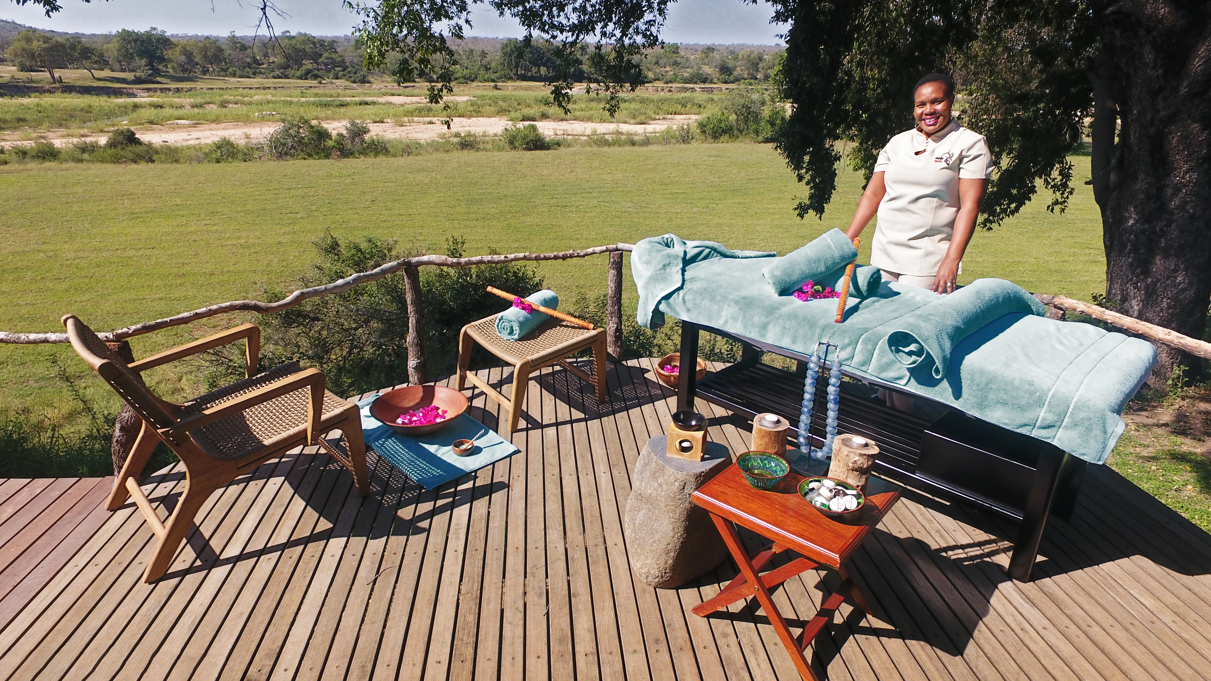 Visitors marvel at a rhino from the infinity pool overlooking the Sand Rhino