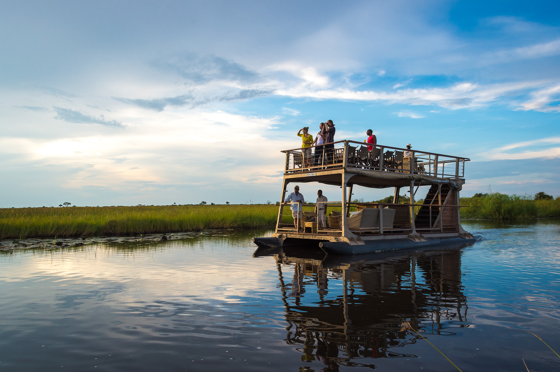 Cruising the serene waters of the Linyanti on the Queen Sylvia