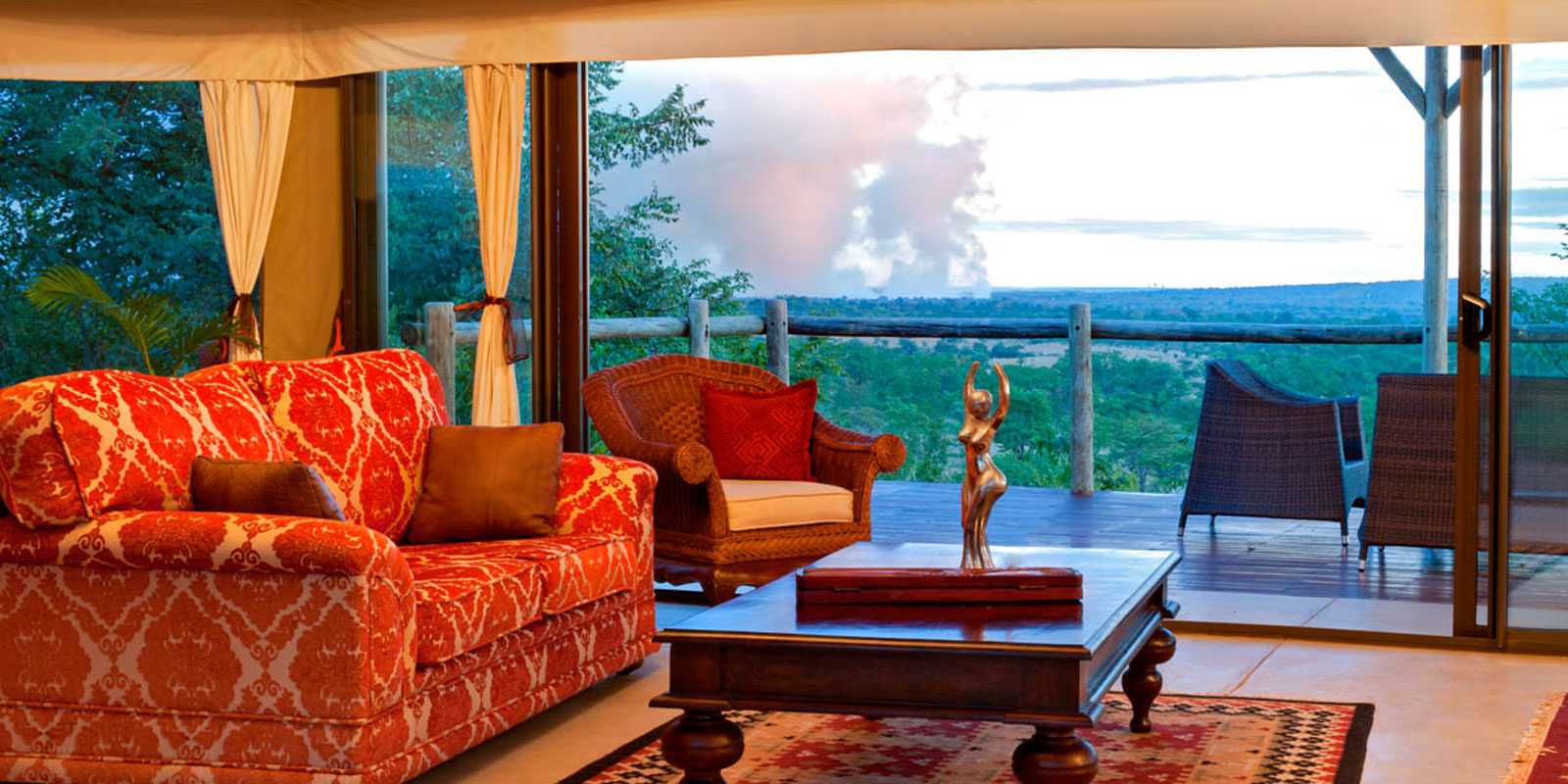 The main lounge area with views of the spray of the Victoria Falls