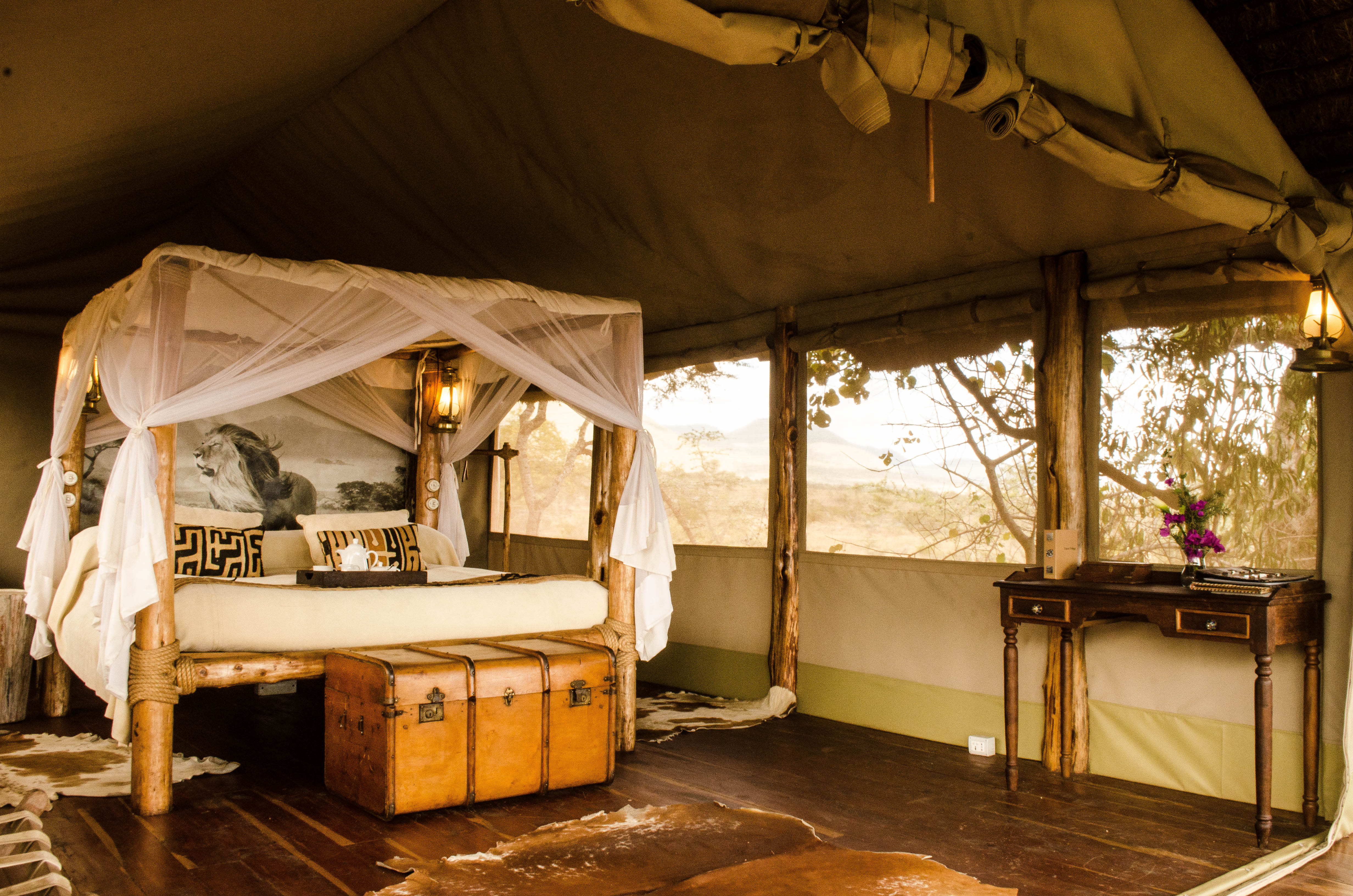 Relax in your own private tented cottage overlooking the vast wilderness from your veranda.