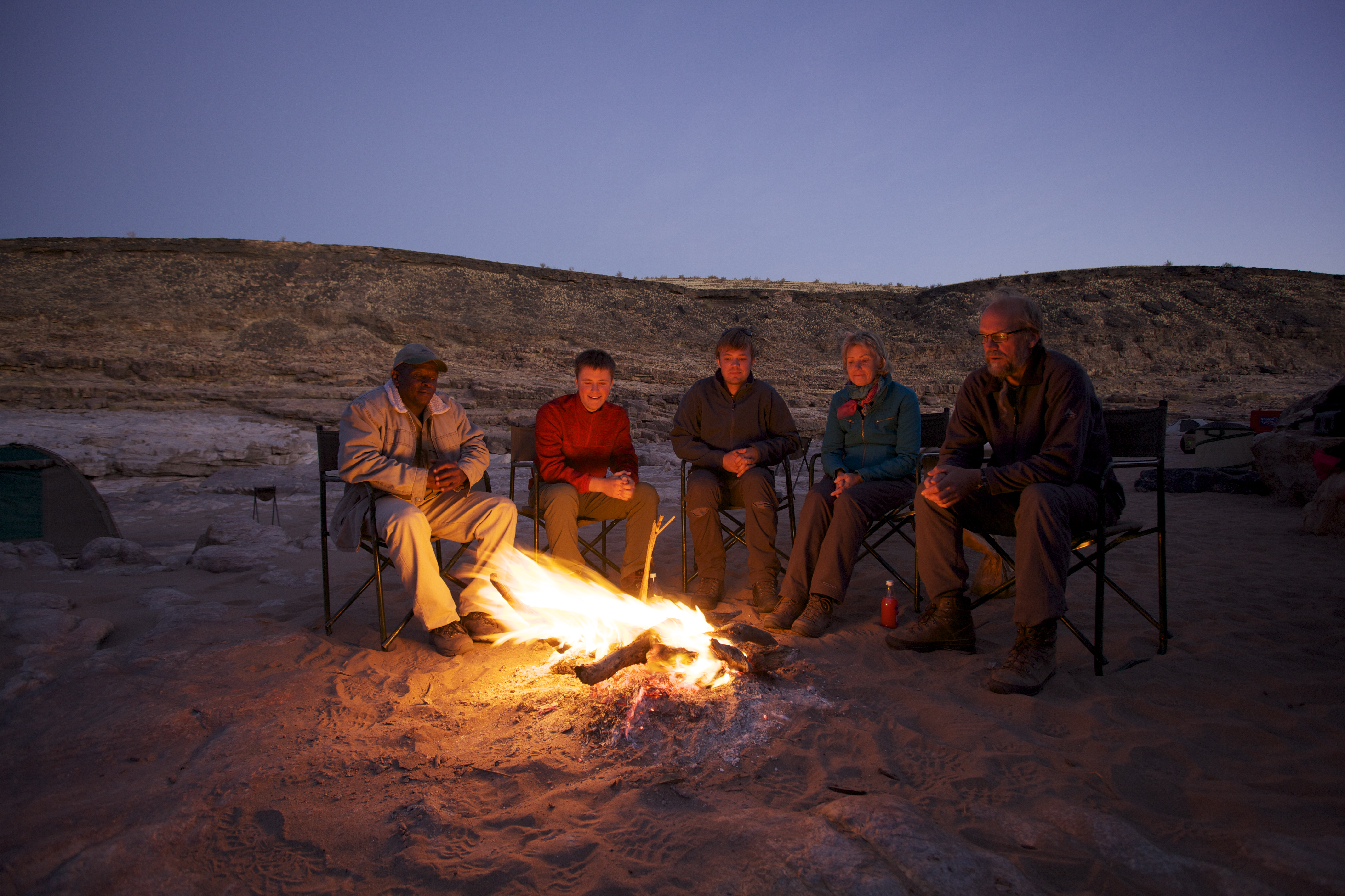 Around the fire in the evening on the hike 