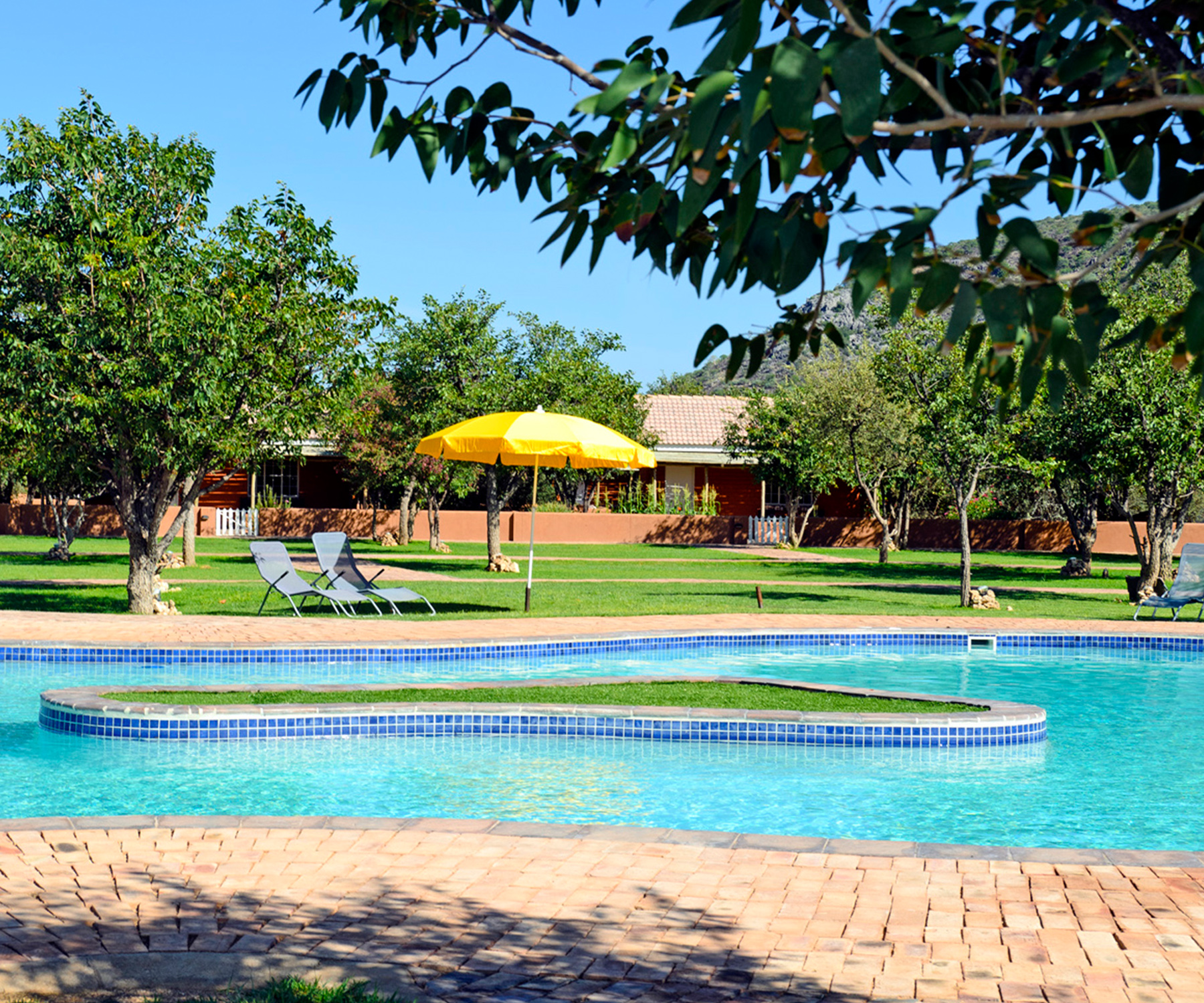 Cool off in the swimming pool at Damara Mopane Lodge