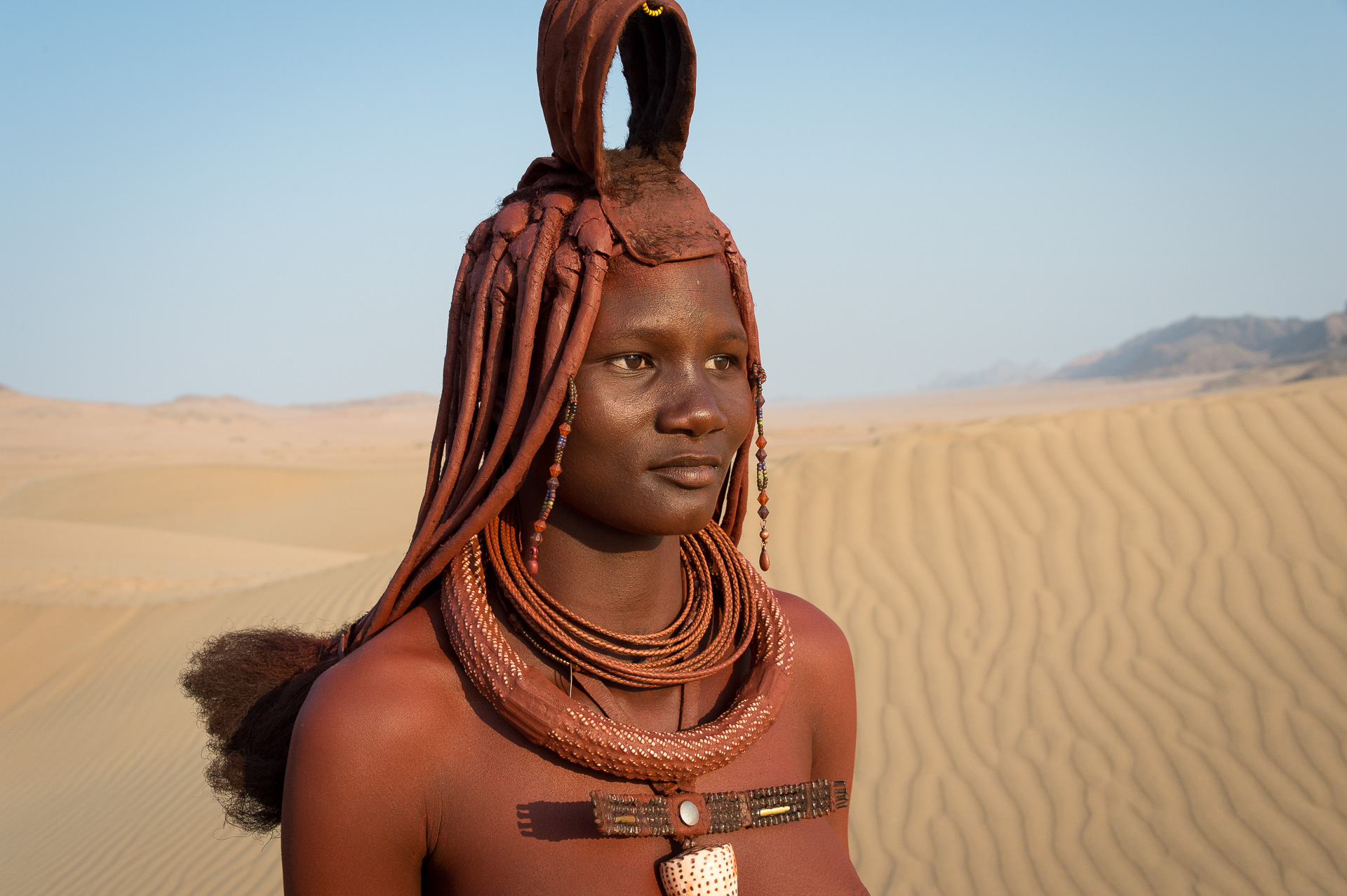 Young Himba woman with elaborate hair and jewellery