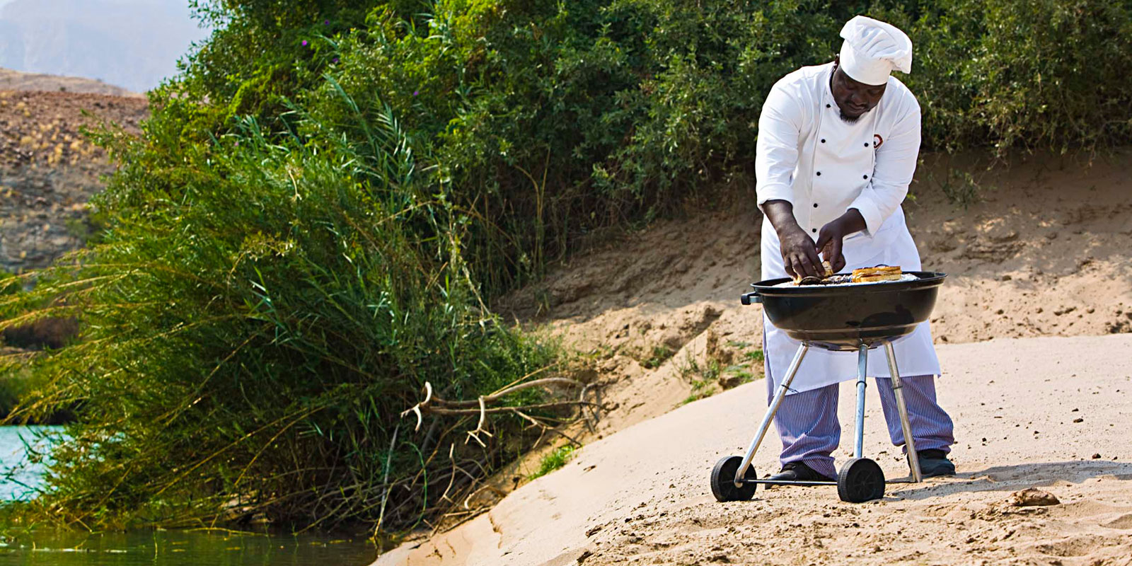 Outdoor dining at Okahirongo River Camp