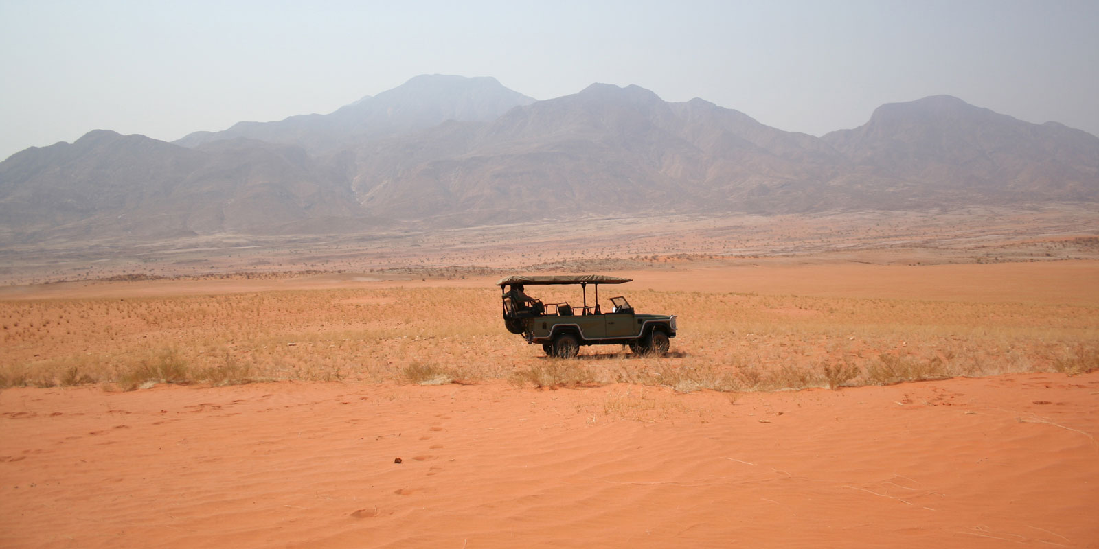 Scenic drive into the mountains or golden sand dunes 
