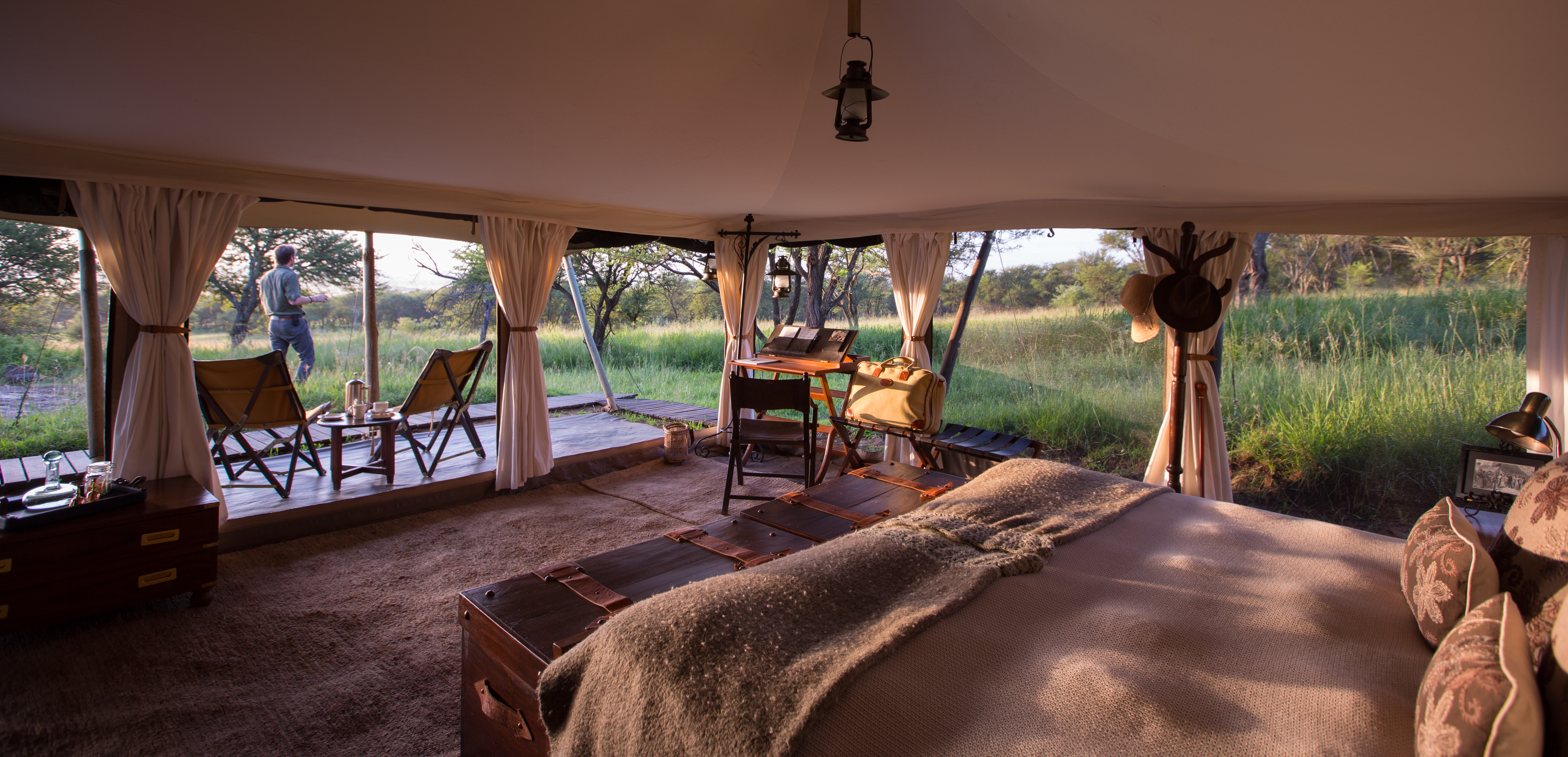 Large tents decorated in traditional safari-style furniture 