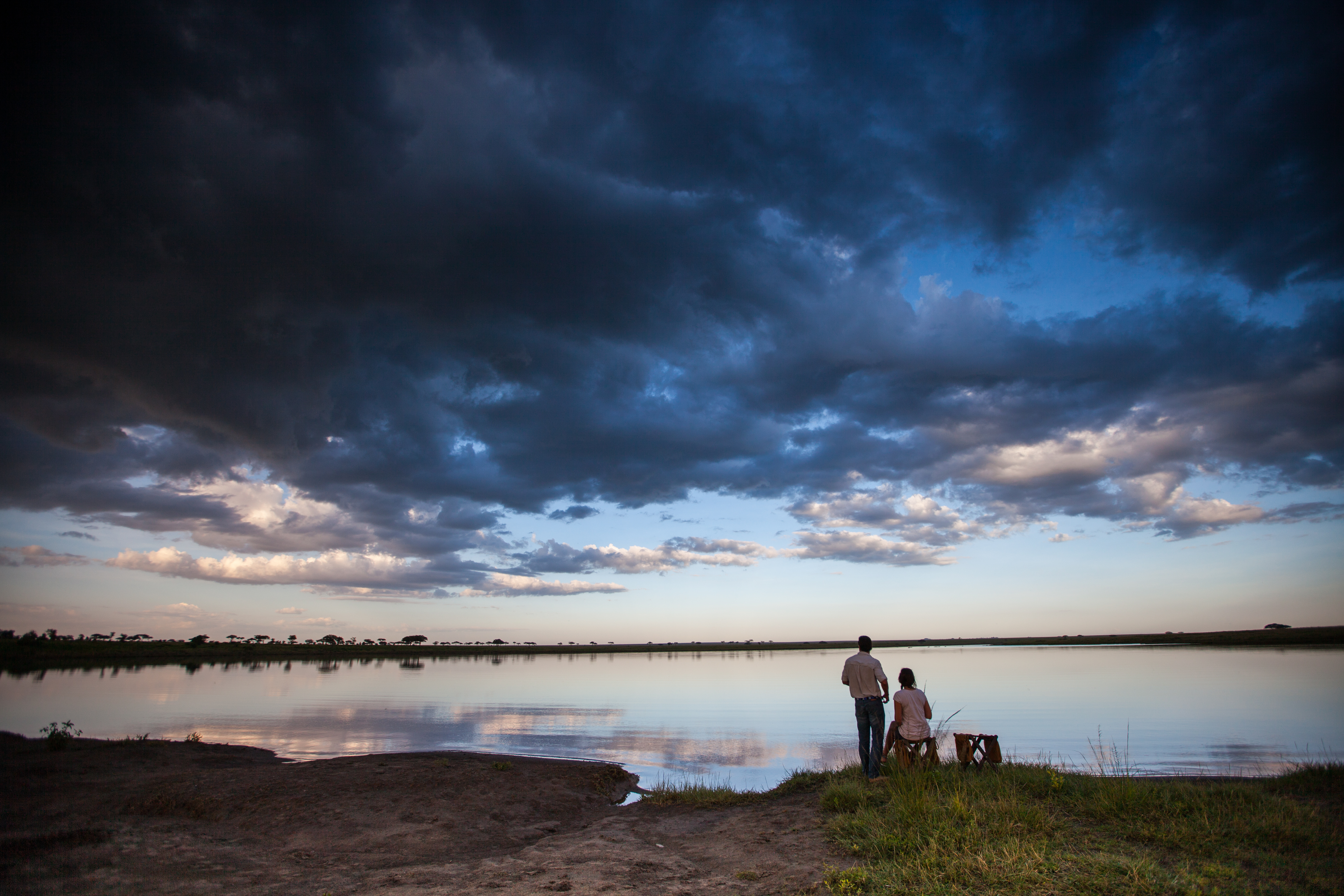 Sundowners and dramatic skies by Lake Madagi