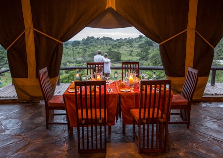 Dining tent with wide balcony and views over the kopje and plains
