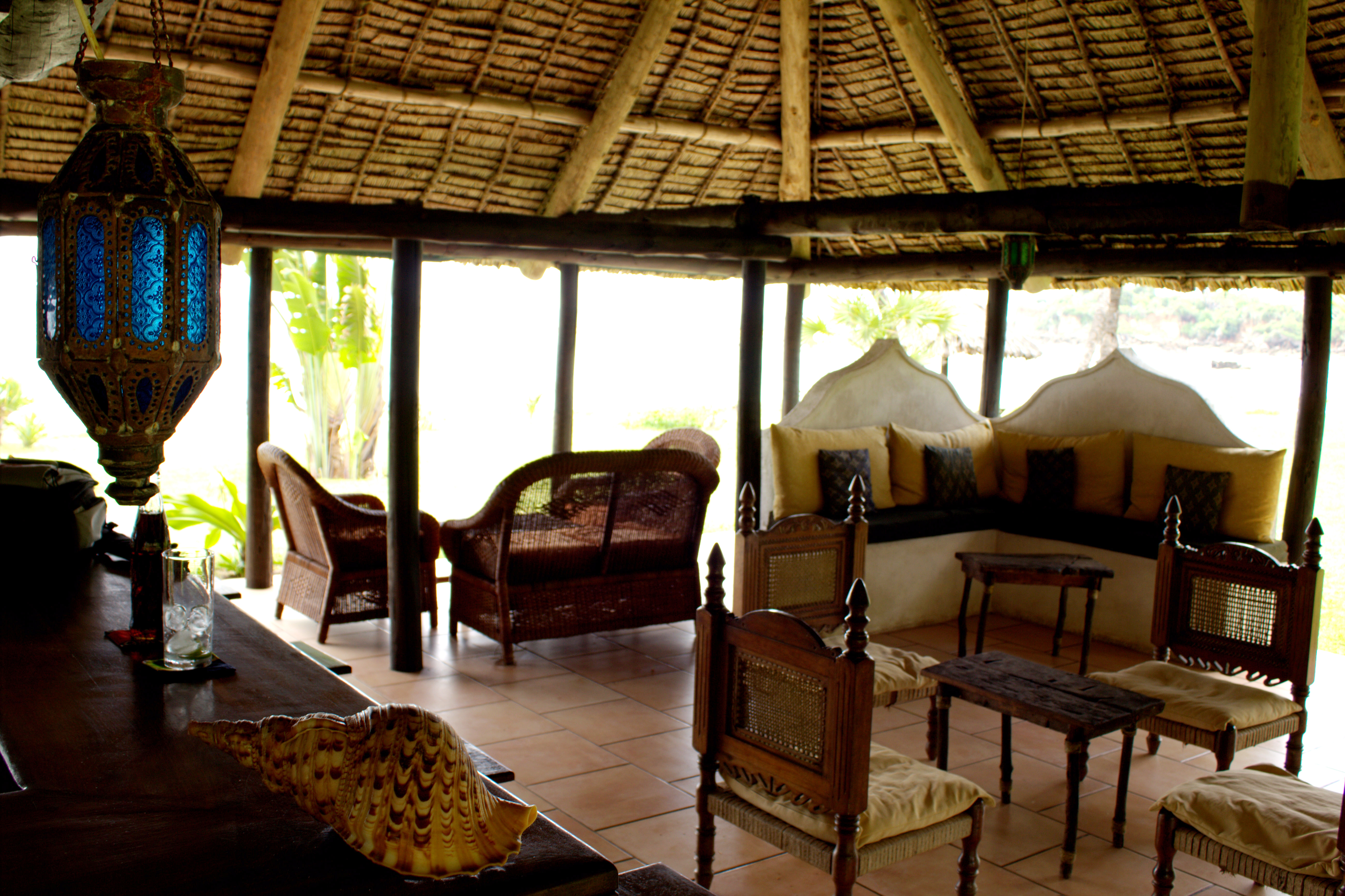 The open-sided makuti thatch beach bar provides the ideal outdoor seating area to enjoy the refreshing coastal breeze without the glare of the African sun