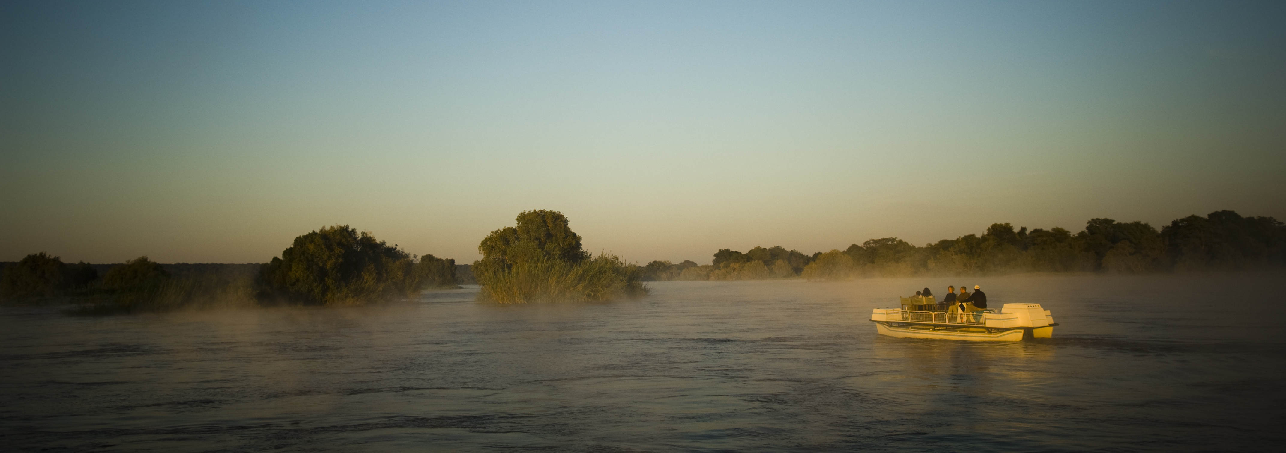 Explore the Upper Zambezi and surrounding Islands on an early morning Sunrise Boat Cruise