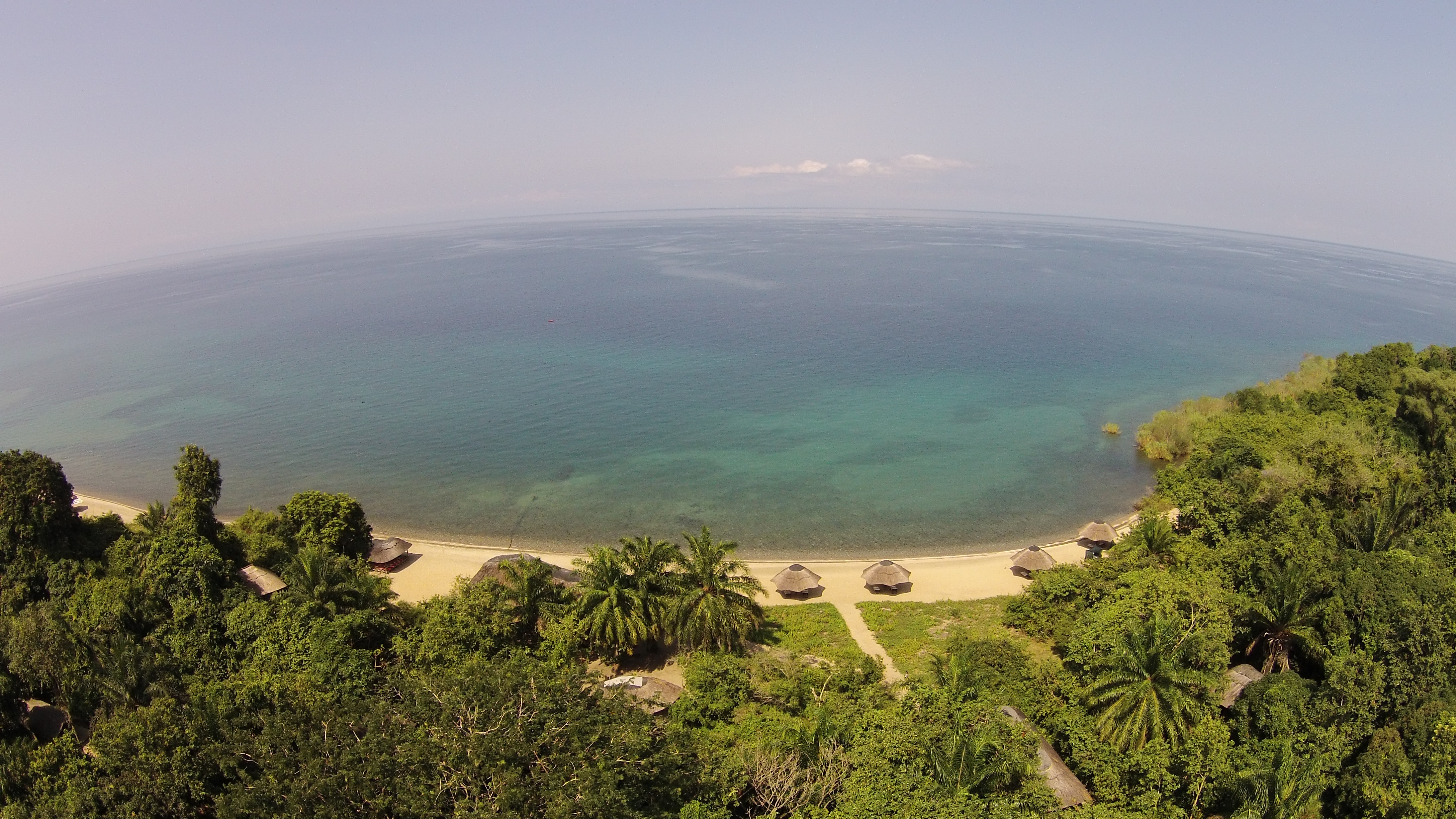 Bird's Eye View of Lake Tangayika and the Beach Banda's made from thatch at Kungwe Beach Lodge