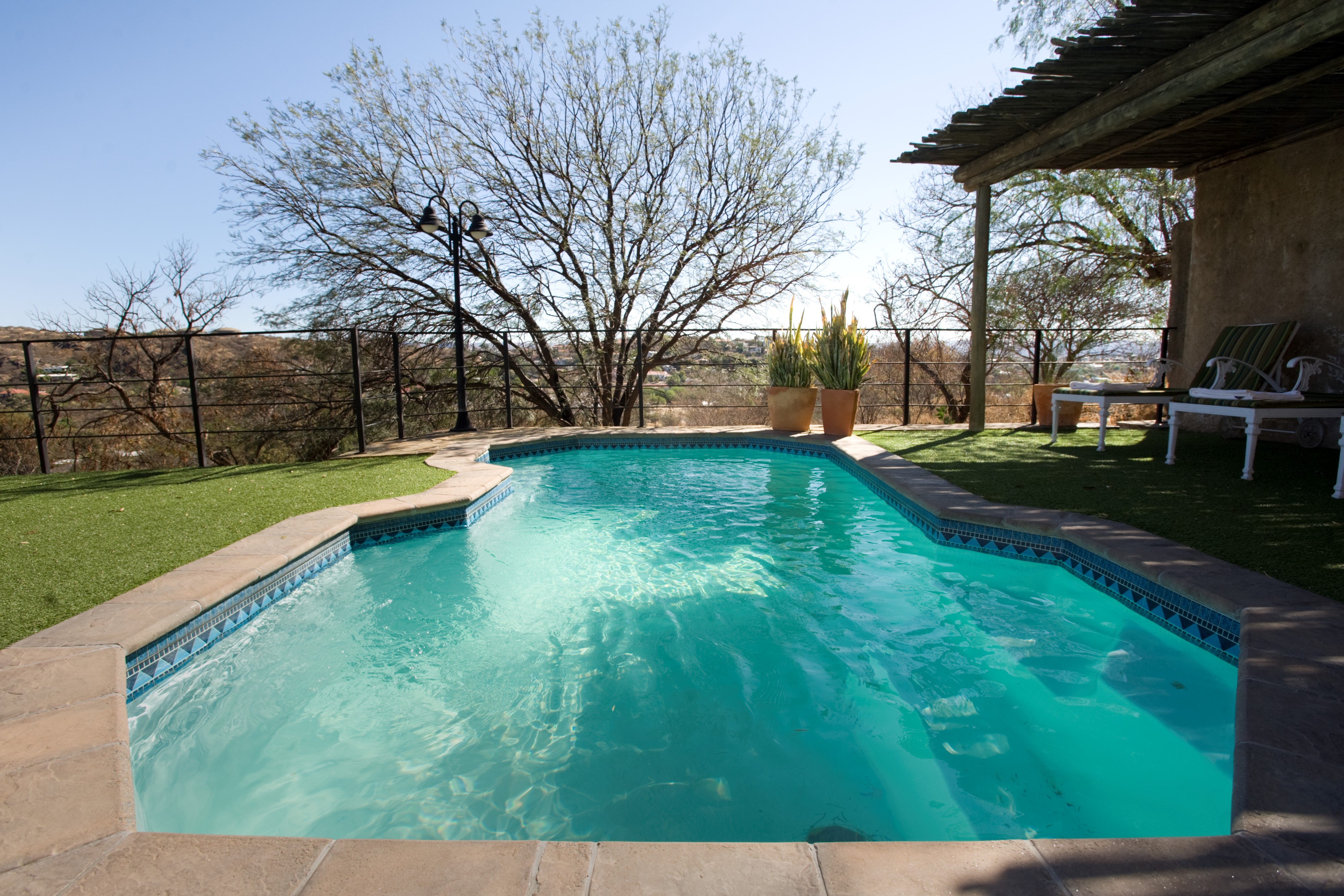 Beat the heat of a Namibian summer by cooling down in a sparkling blue  swimming pool!