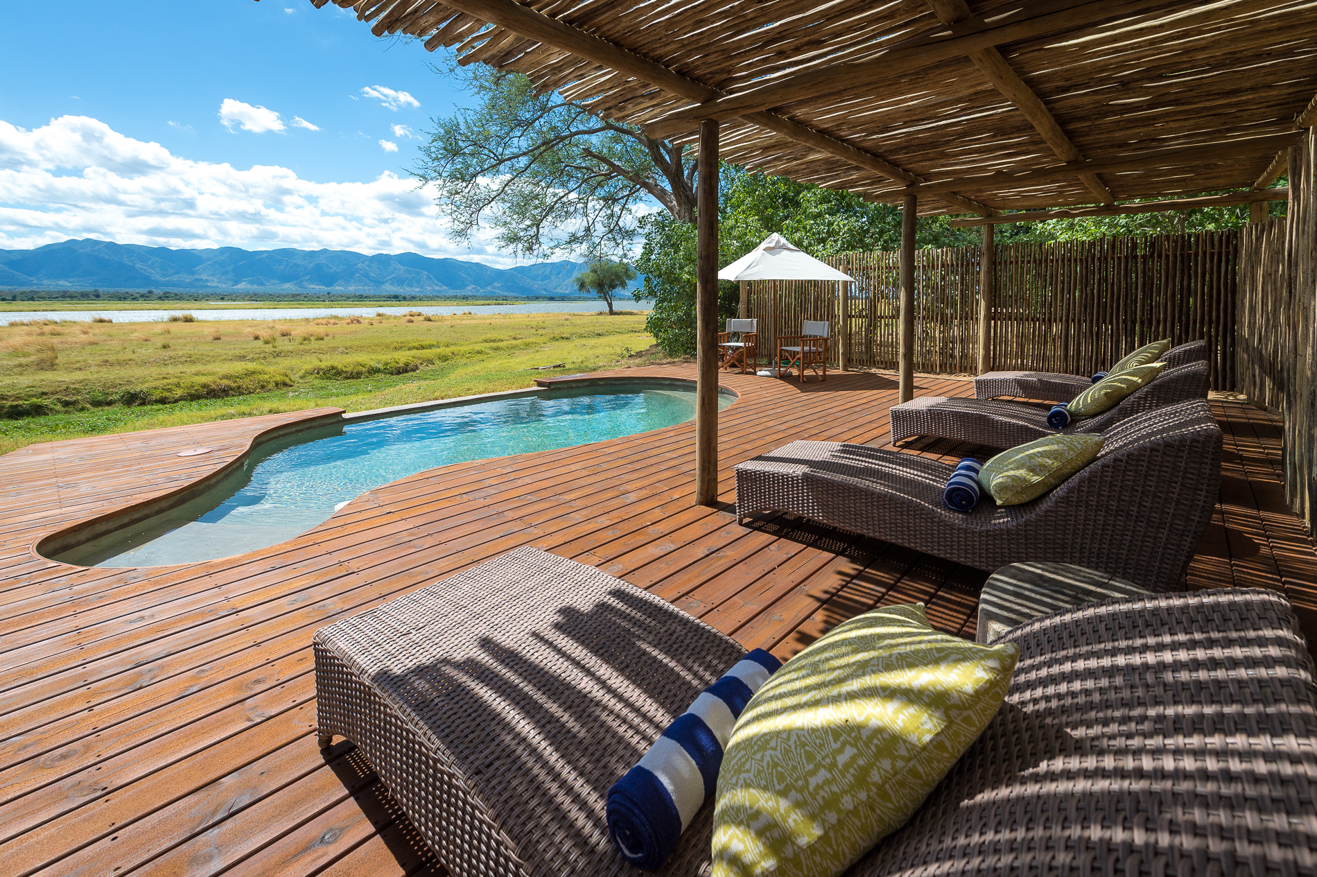 The pool area has sweeping views of the Zambian escarpment over the river