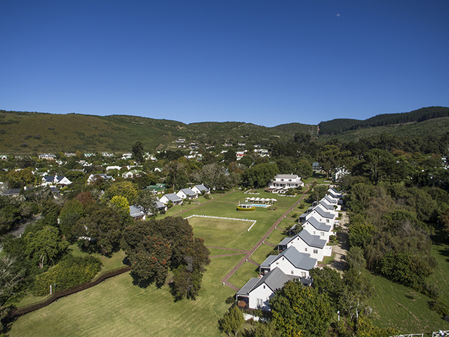 A view of Belvidere Manor from over the lagoon