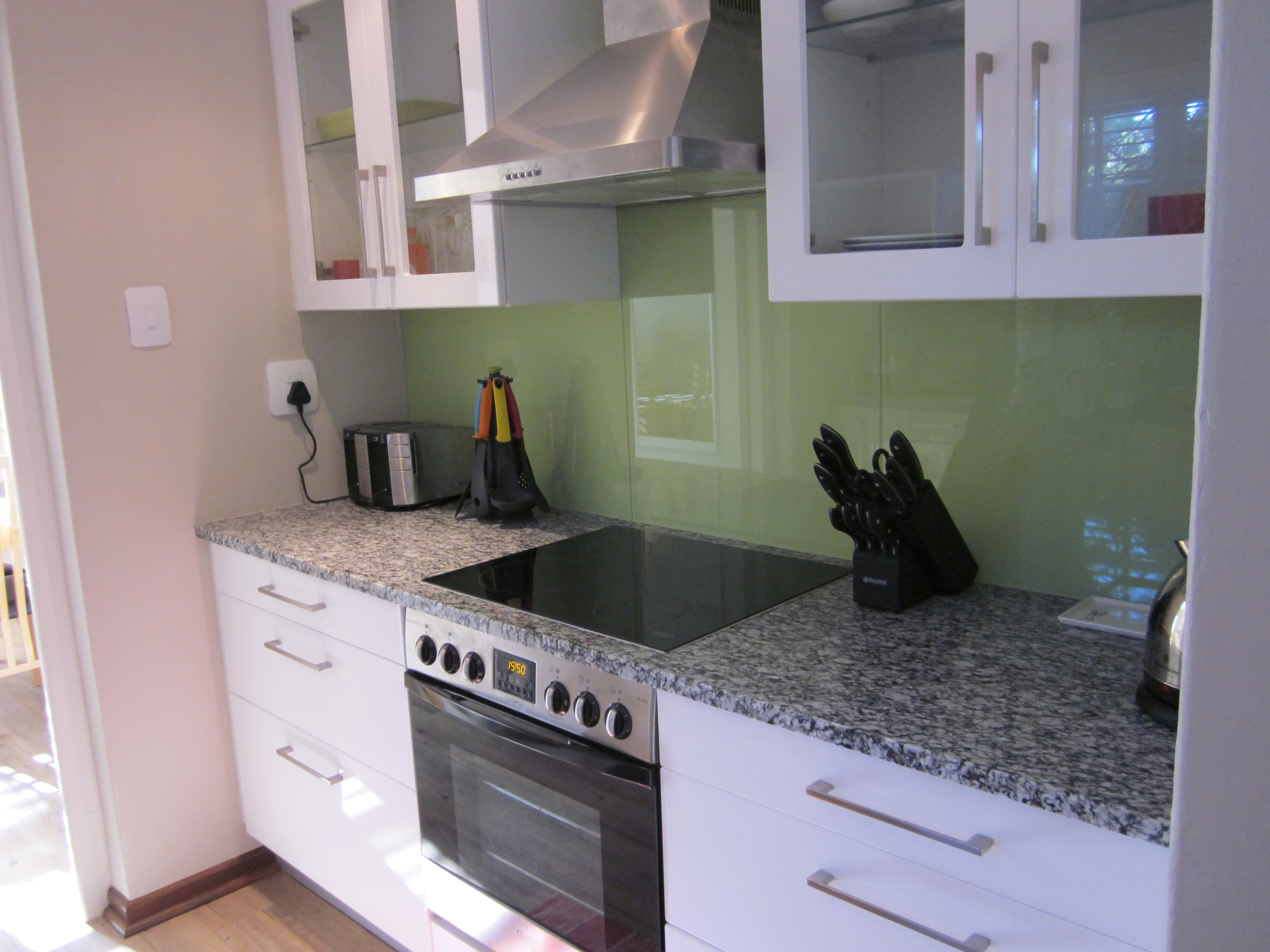 The kitchen in Quainton cottage includes an electric stove