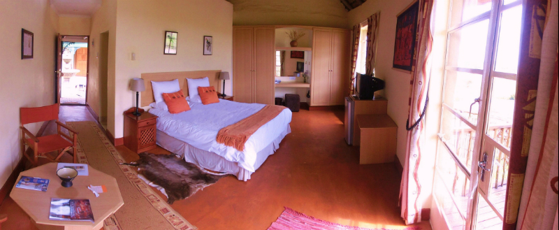 Entry from the central courtyard and access to private deck through french doors