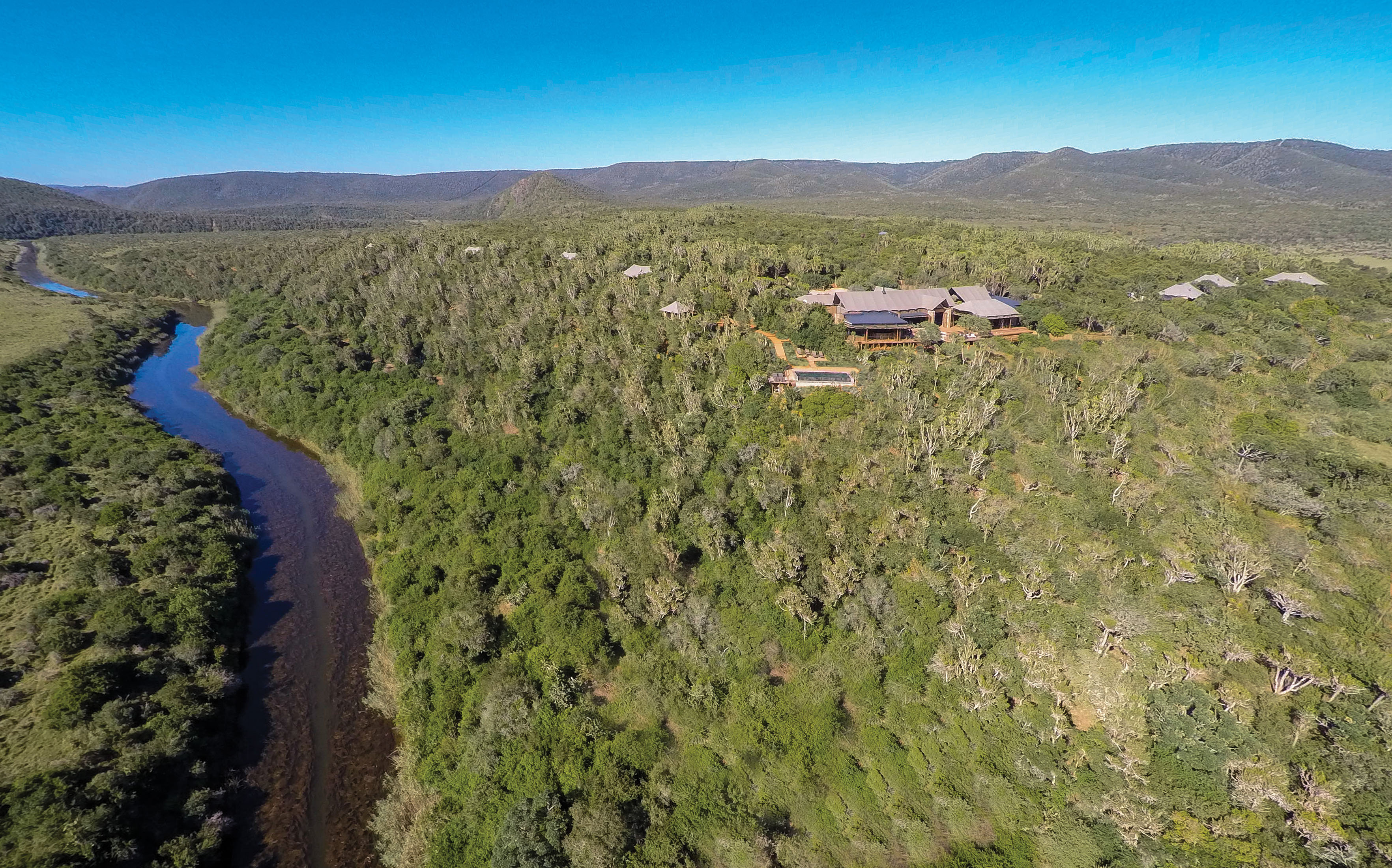 The site is beautiful alongside the river and with views across the plains to the bush beyond.
