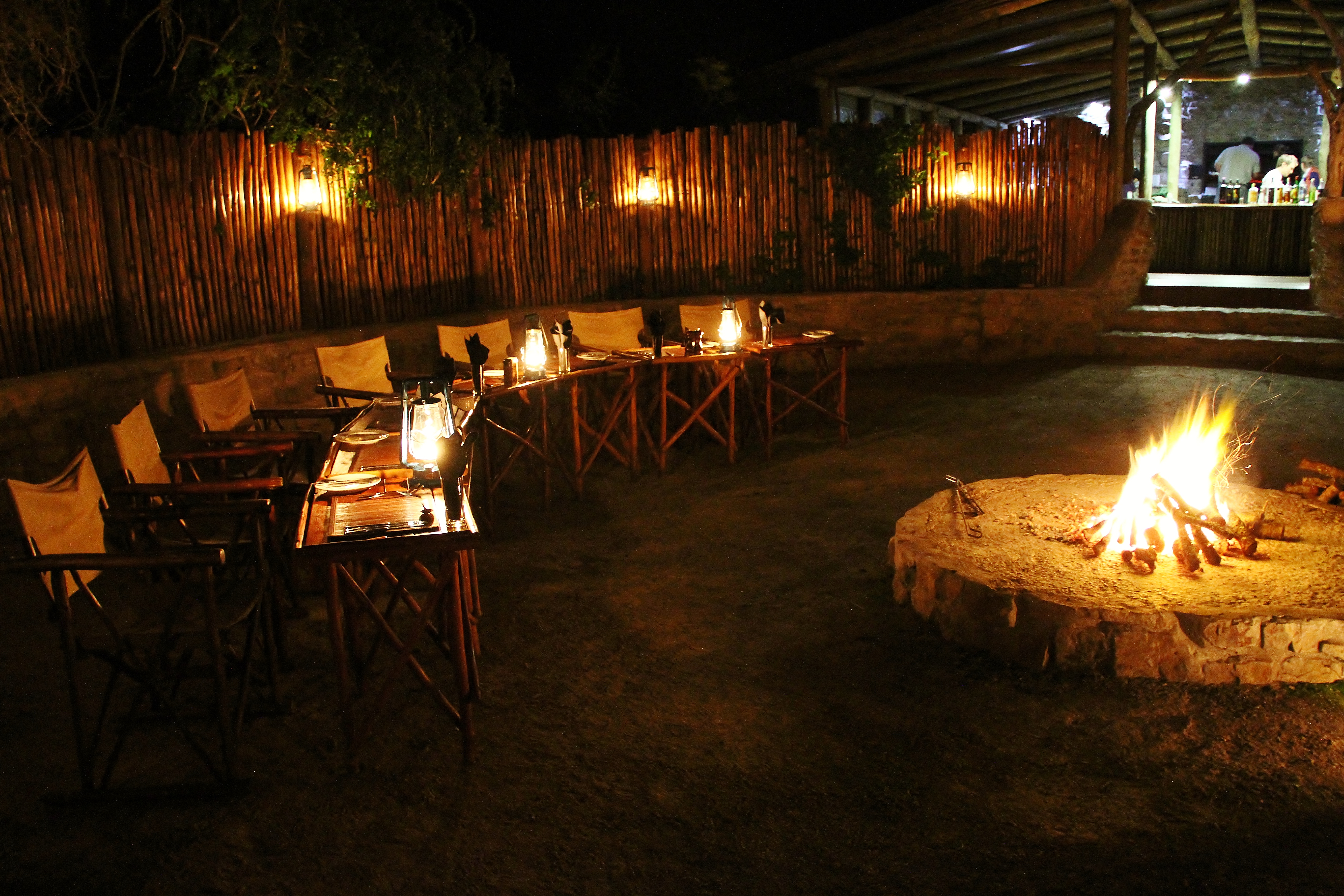 Guests are served fine fireside fare in the warm embrace of the evening fire.