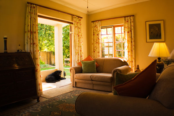 The lounge leads on to a small private patio which overlooks the swimming pool.