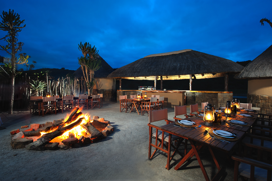 Experience African dining by the light of lanterns and an open fire. 