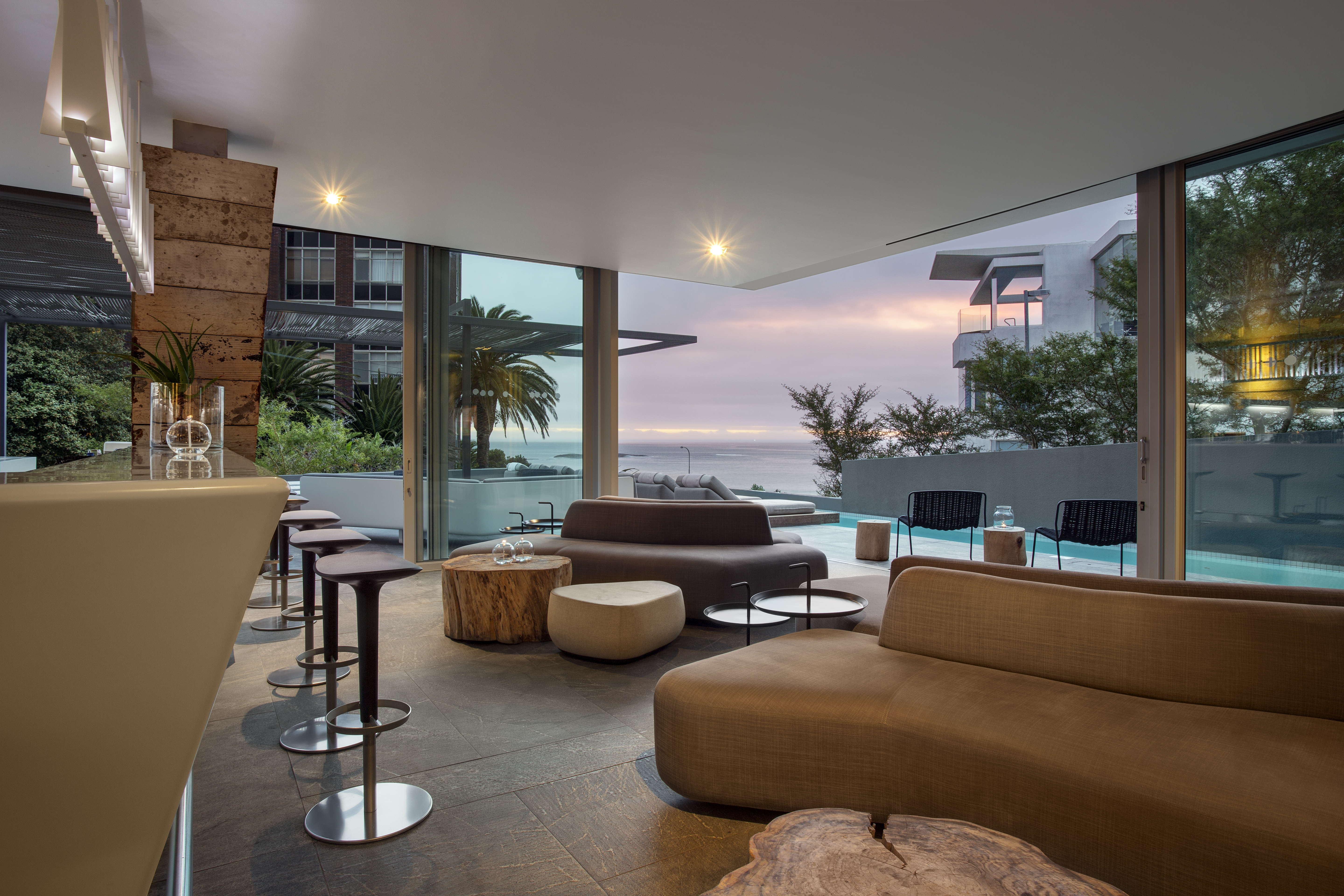 Lounge, bar and pool area overlooking Camps Bay beach