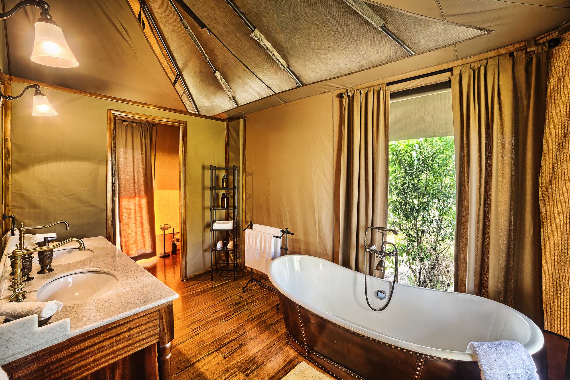 A decadent bath, or an adventurous outdoor shower await after a day of safari.
