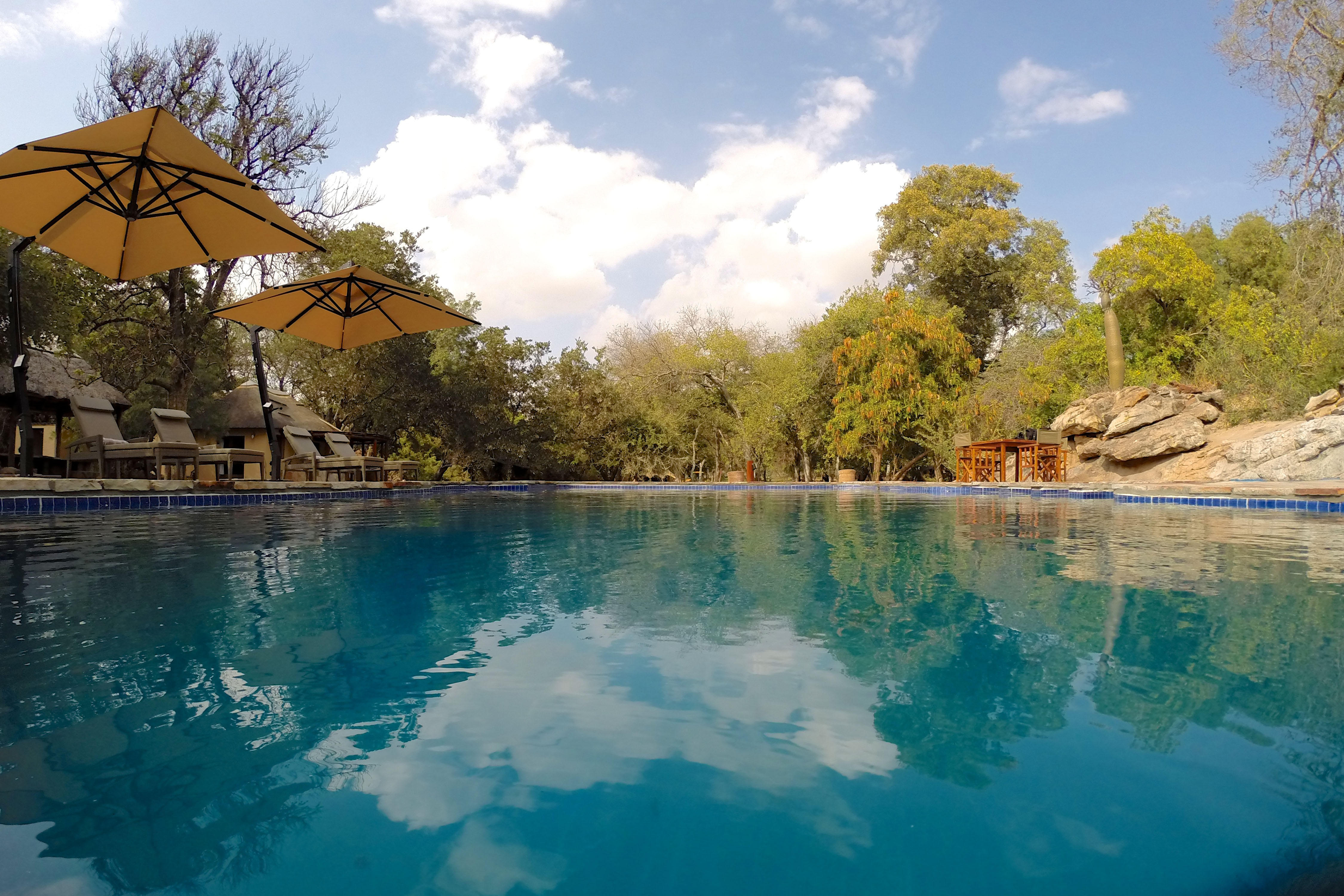 Enjoy a refreshing dip in the large swimming pool, which has a small shallow section for children and is beautifully positioned by a secluded rocky outcrop