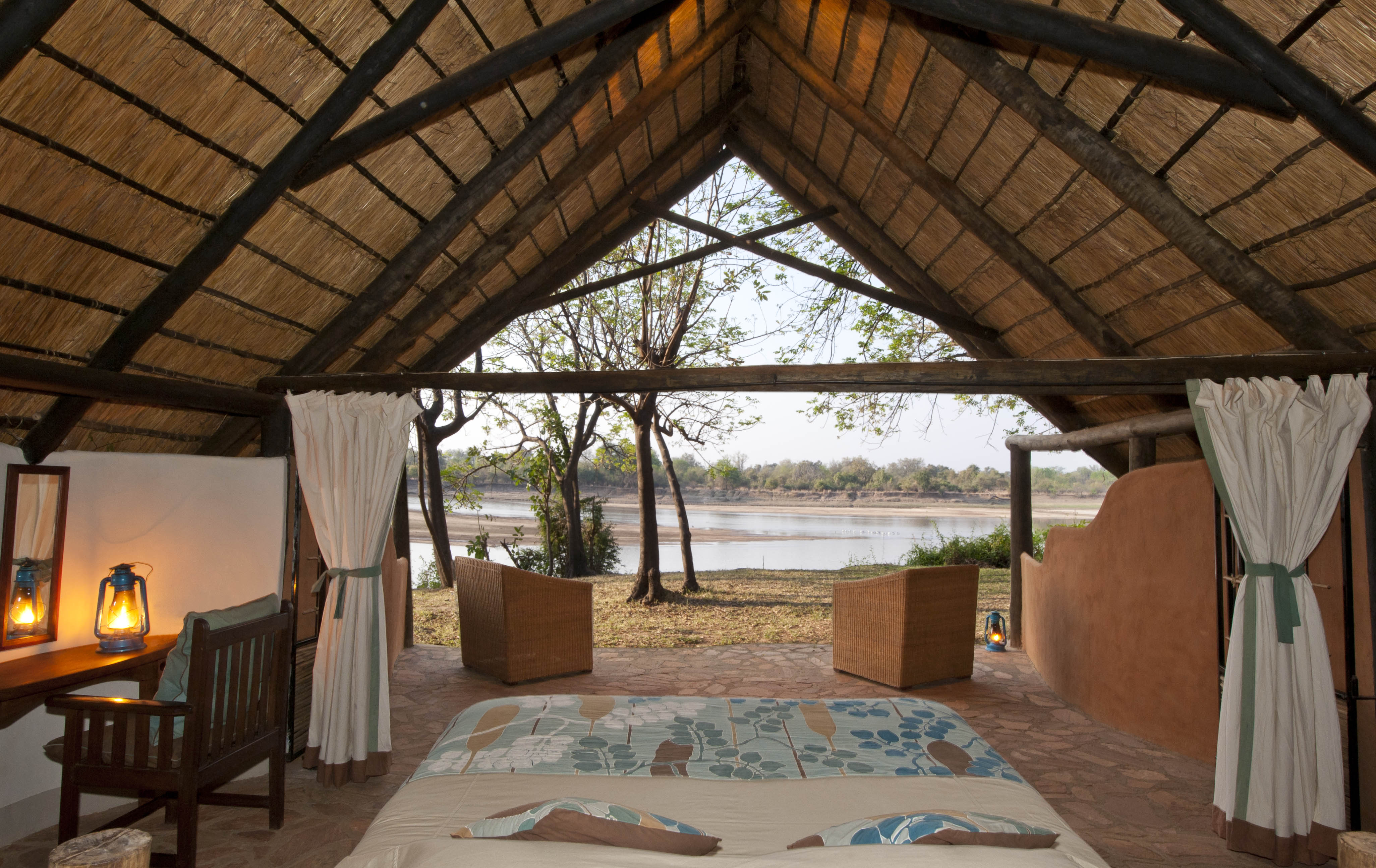 Private open fronted chalets looking onto the Luangwa and Park