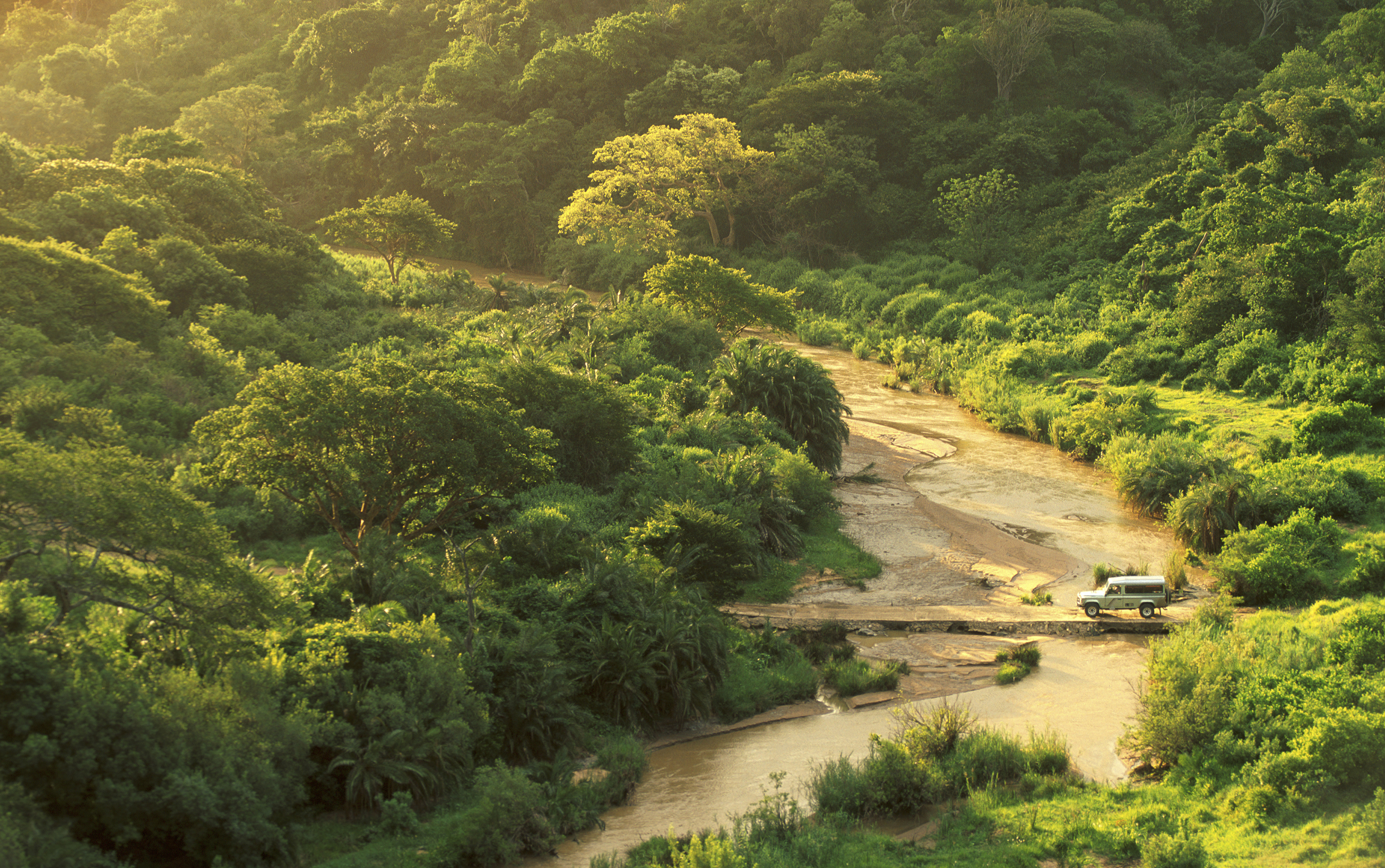 Landrover crossing the river in the Hluhluwe Imfolosi Park