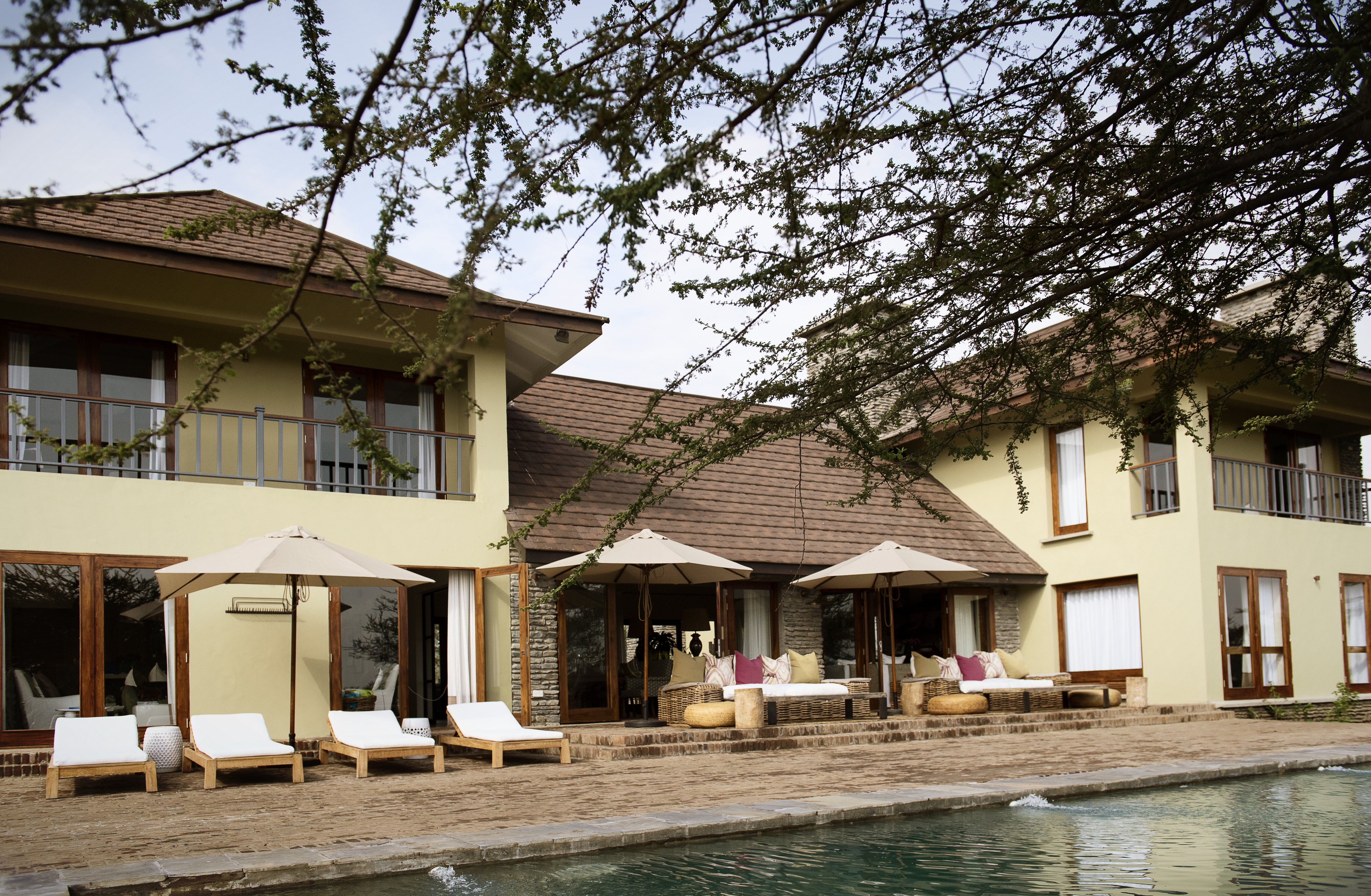 The Pool Terrace and Infinity Lap Pool overlook the 5th Fairway of the Kilimanjaro Golf Course.