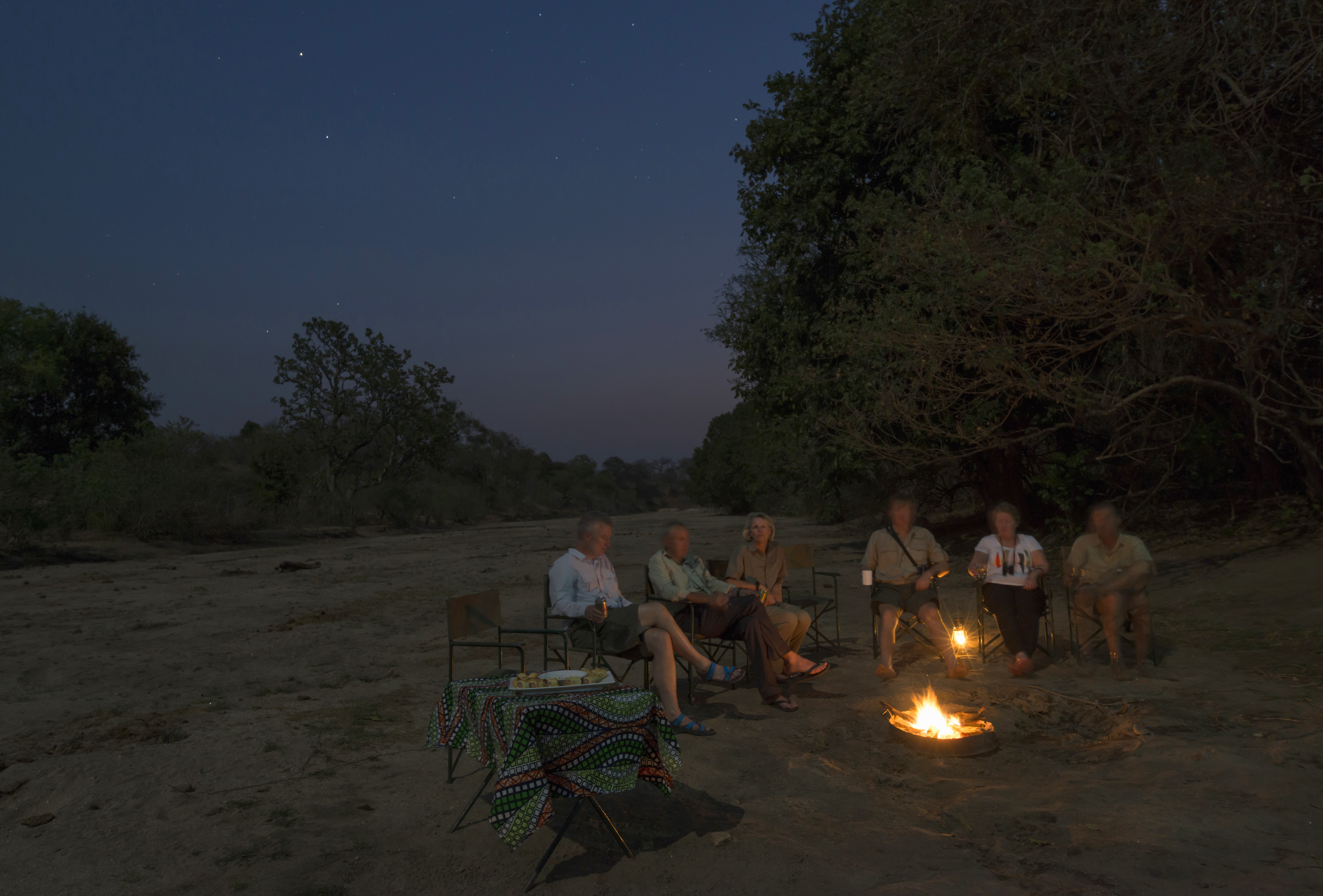After dinner sit and unwind under the expanse of the African sky.