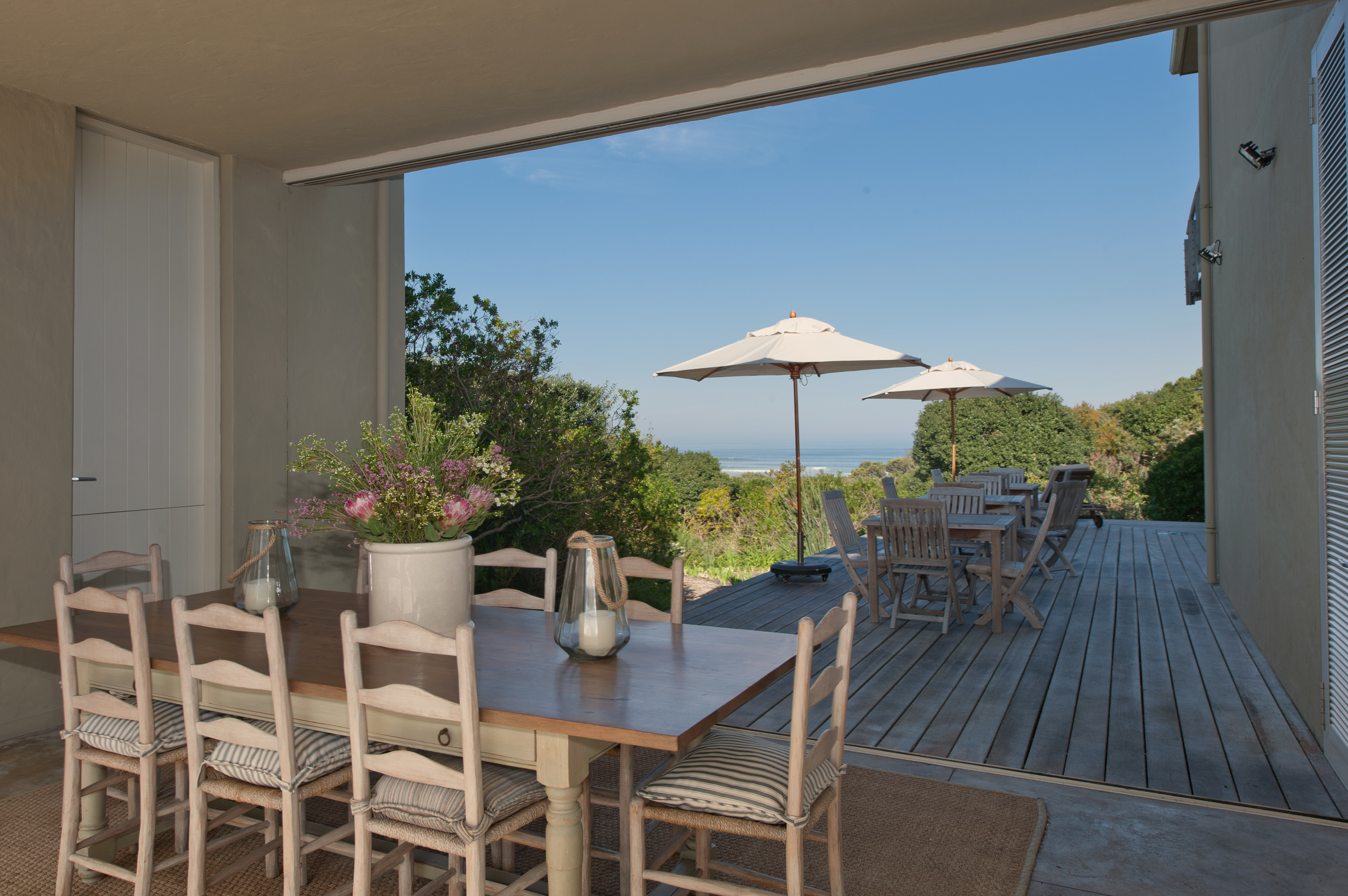 Dining on the deck overlooking our natural Fynbos garden