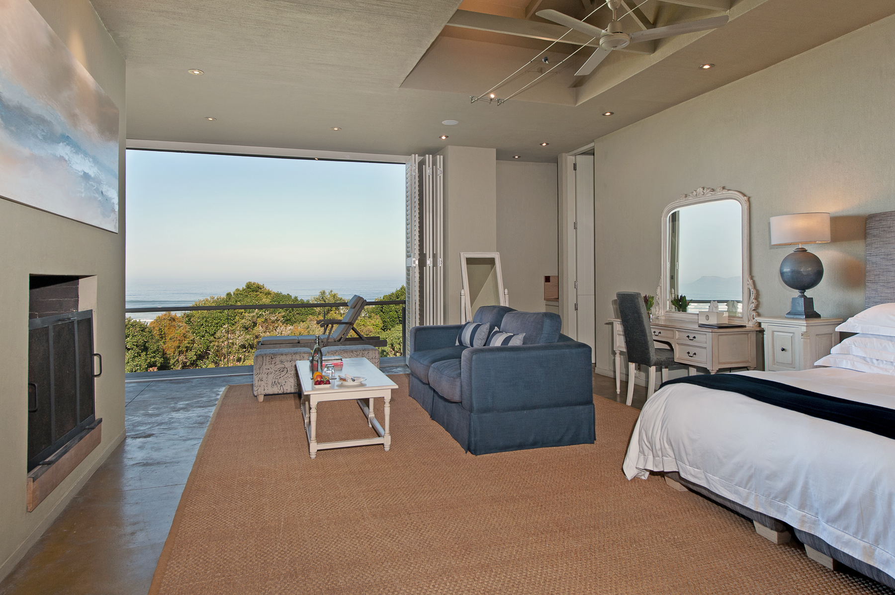 King bed, seating area and fire place in the Southern Right suite