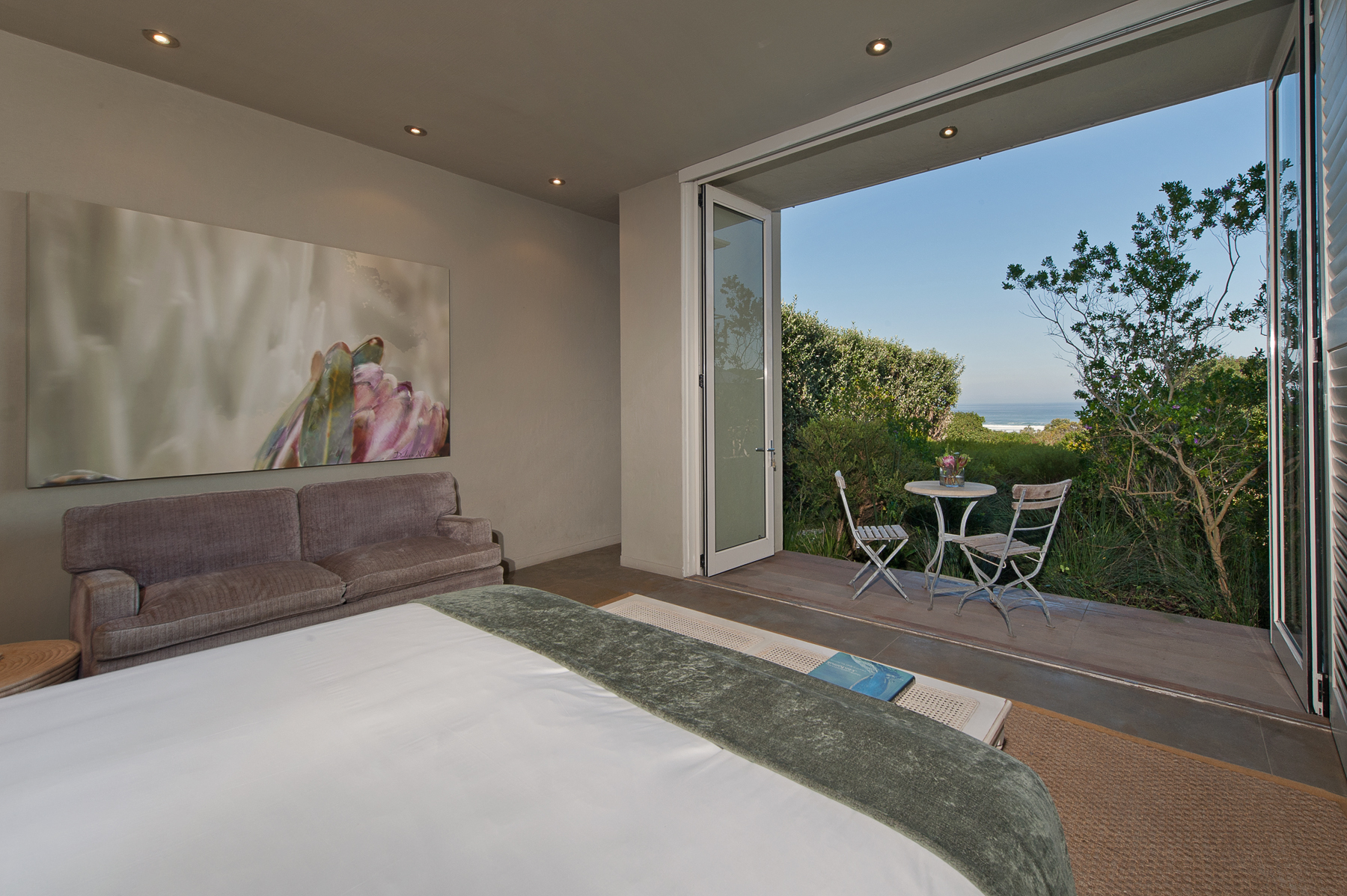 King bed, double sleeper couch and balcony of Fynbos executive suite