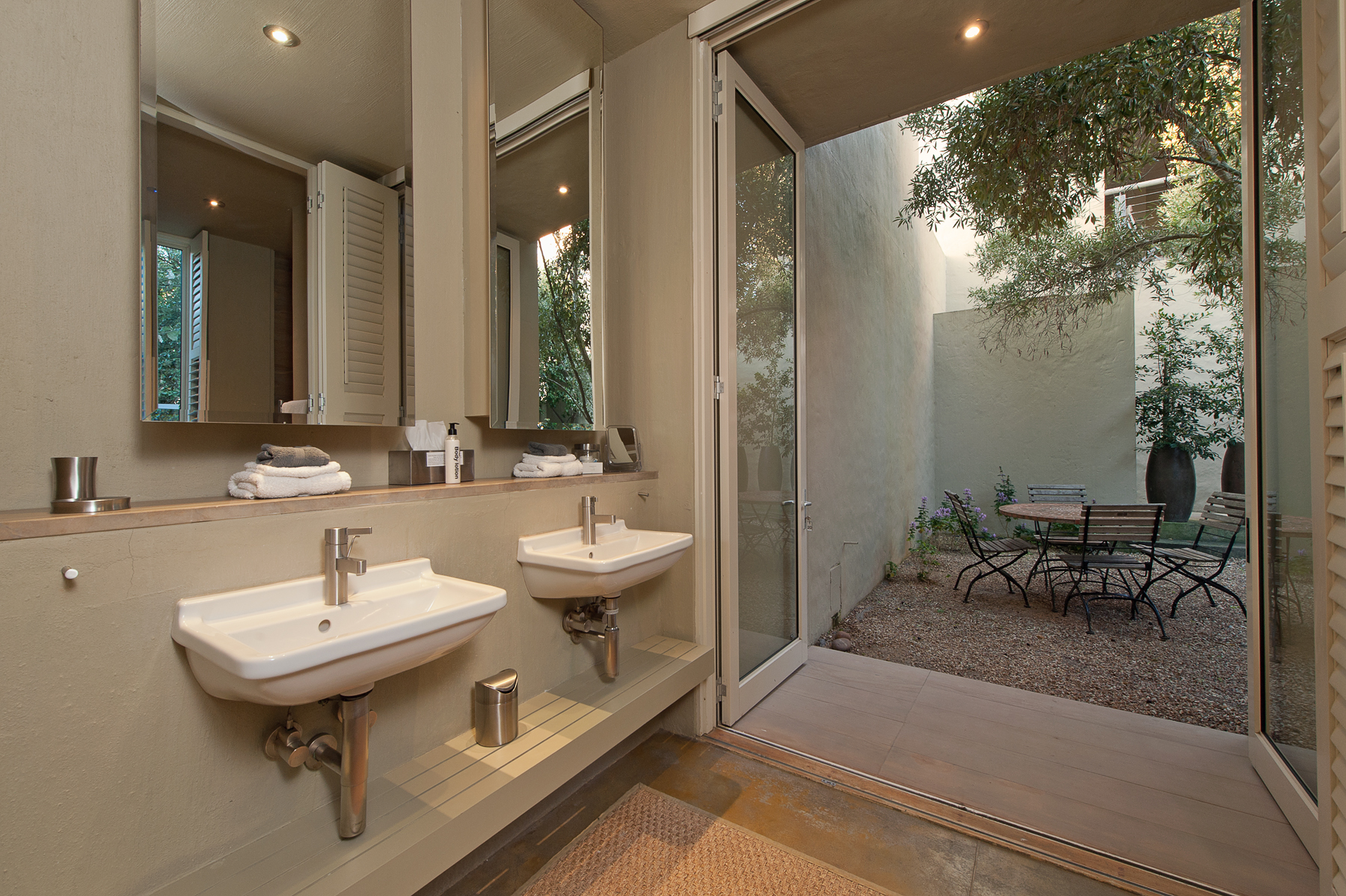 Fynbos executive suite double basins opening up into a semi private back quart yard with seating
