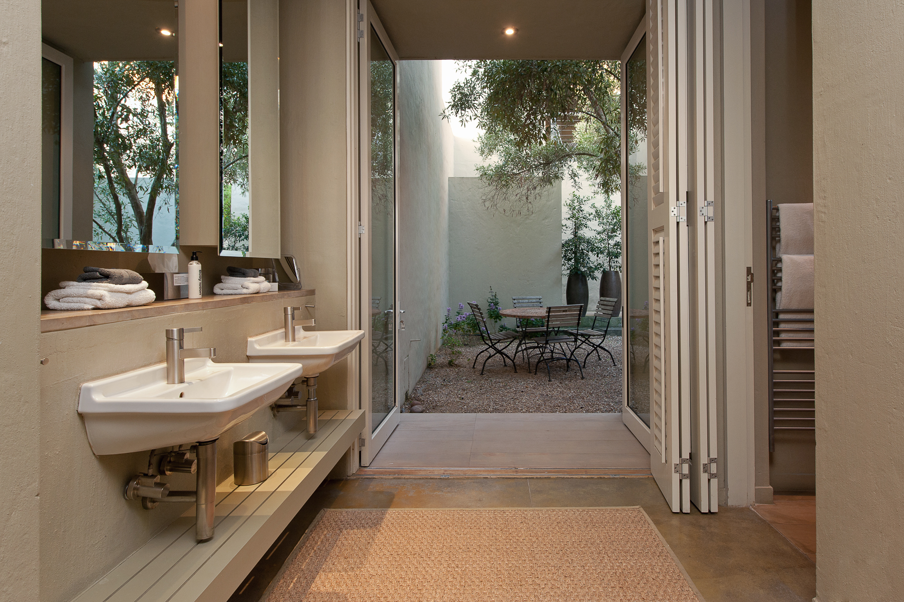 Double basins and bathroom oentrance to the right with a semi private quart yard leading from Fynbos executive suite