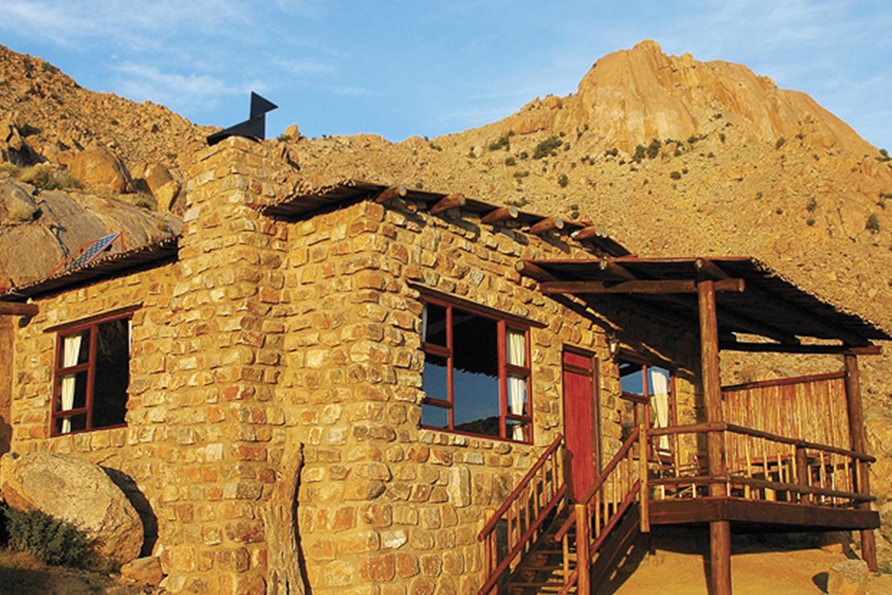 Each of the natural rock chalets sits between massive granite boulders and contains a bathroom, kitchenette, fireplace and private veranda.