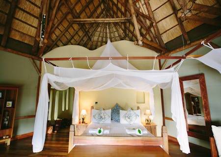 Large ensuite bedrooms with a combination of double and twin beds and an additional day bed. A writing desk, small lounge and private deck to enjoy the views