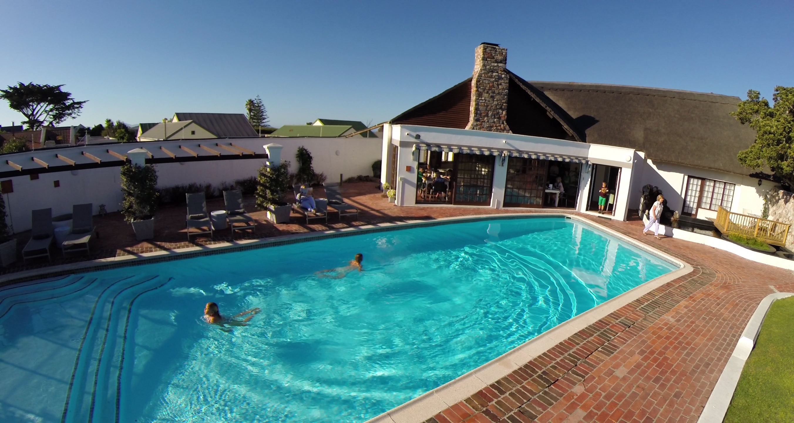 Kids swimming in solar heated pool