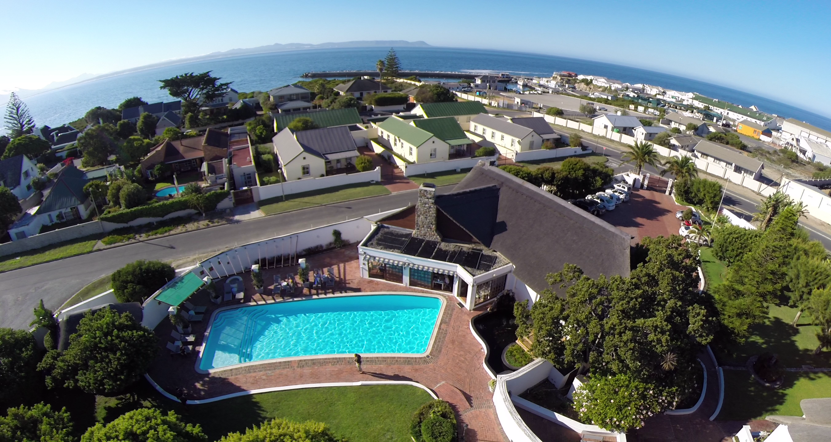 Birds eye view from Whale Rock to the nearby ocean and harbour