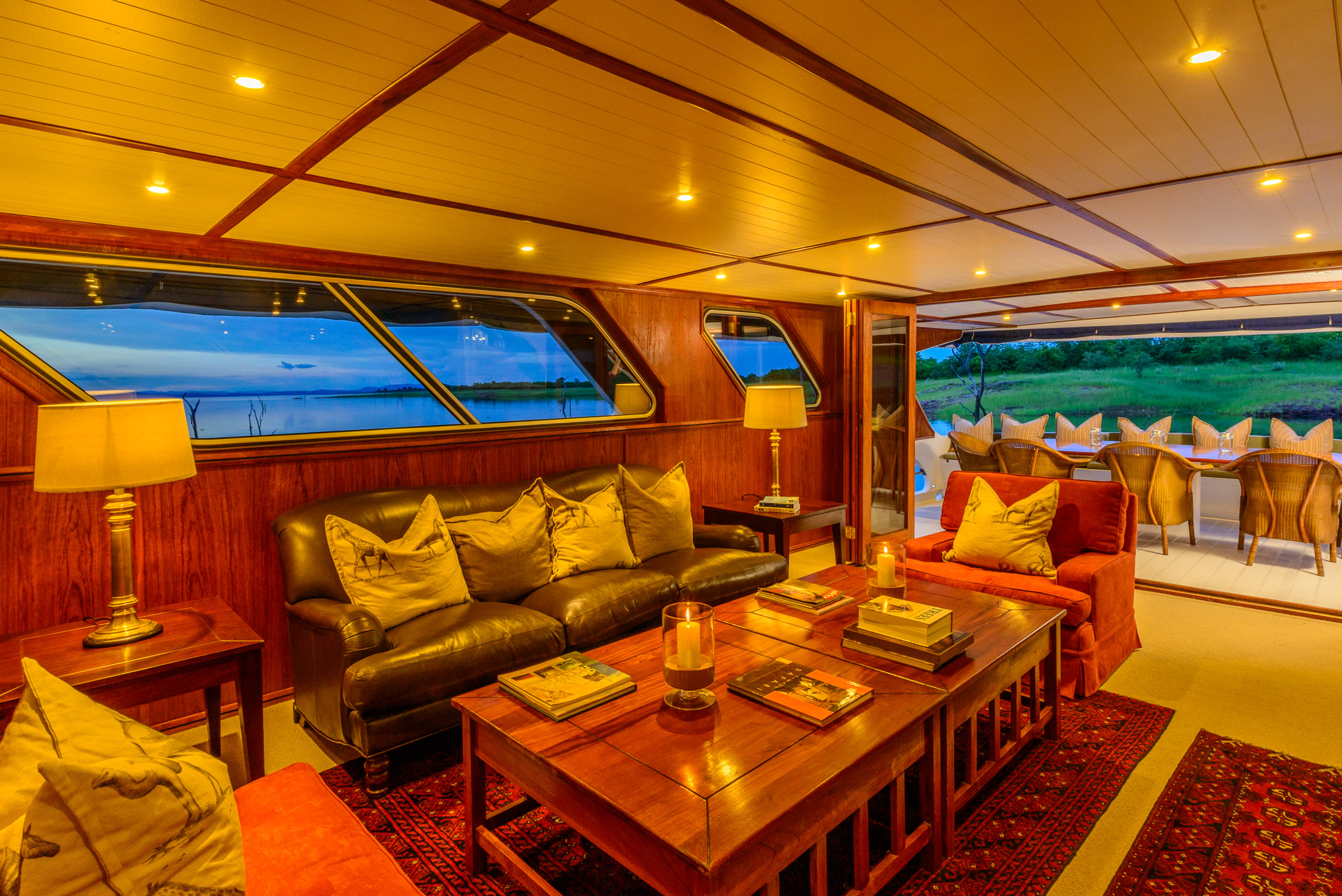 The middle deck offers a spacious and elegantly decorated dining area and lounge, opening up onto a covered verandah for al fresco meals.